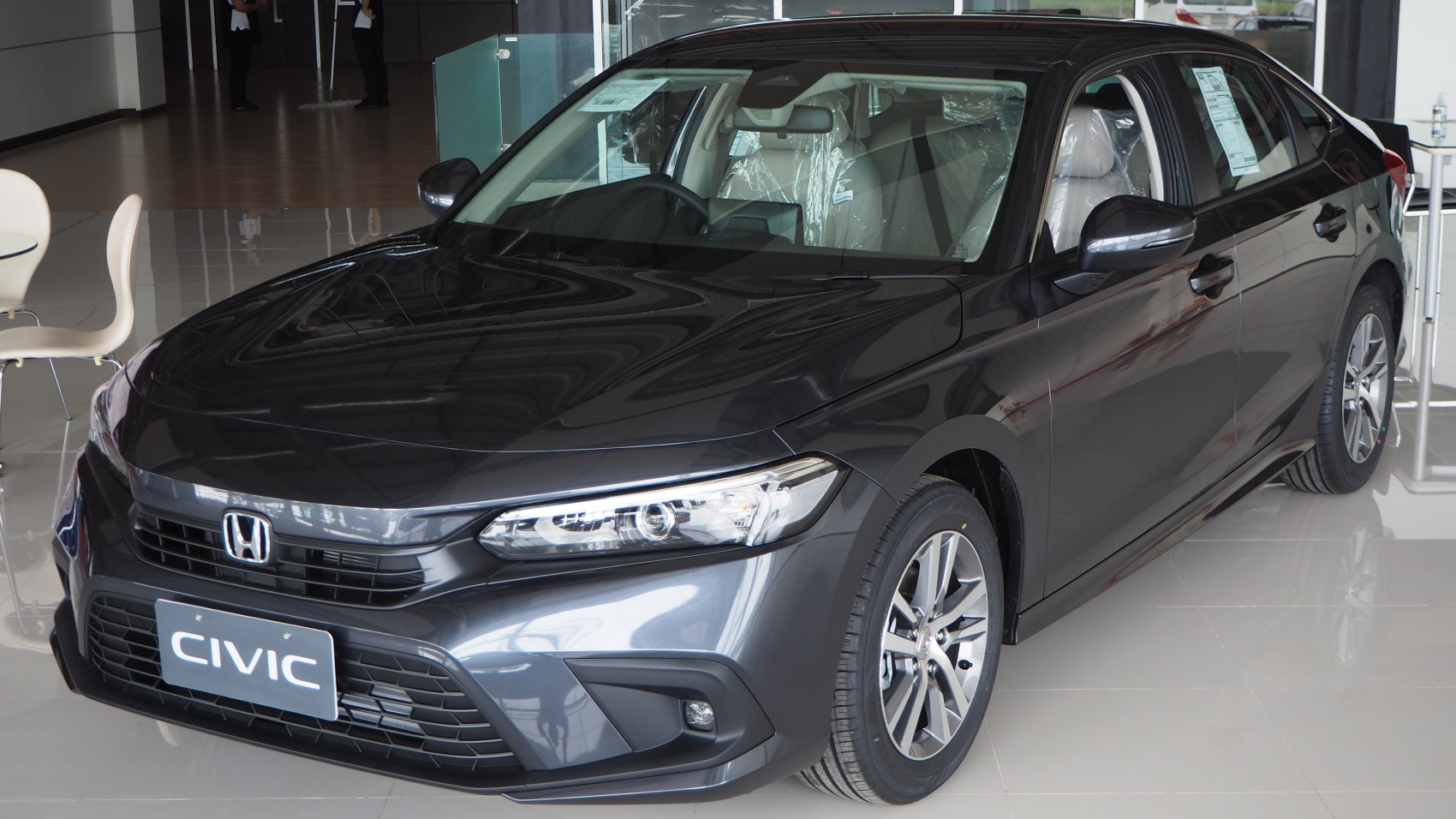 Front and side profile with headlights and alloy wheels