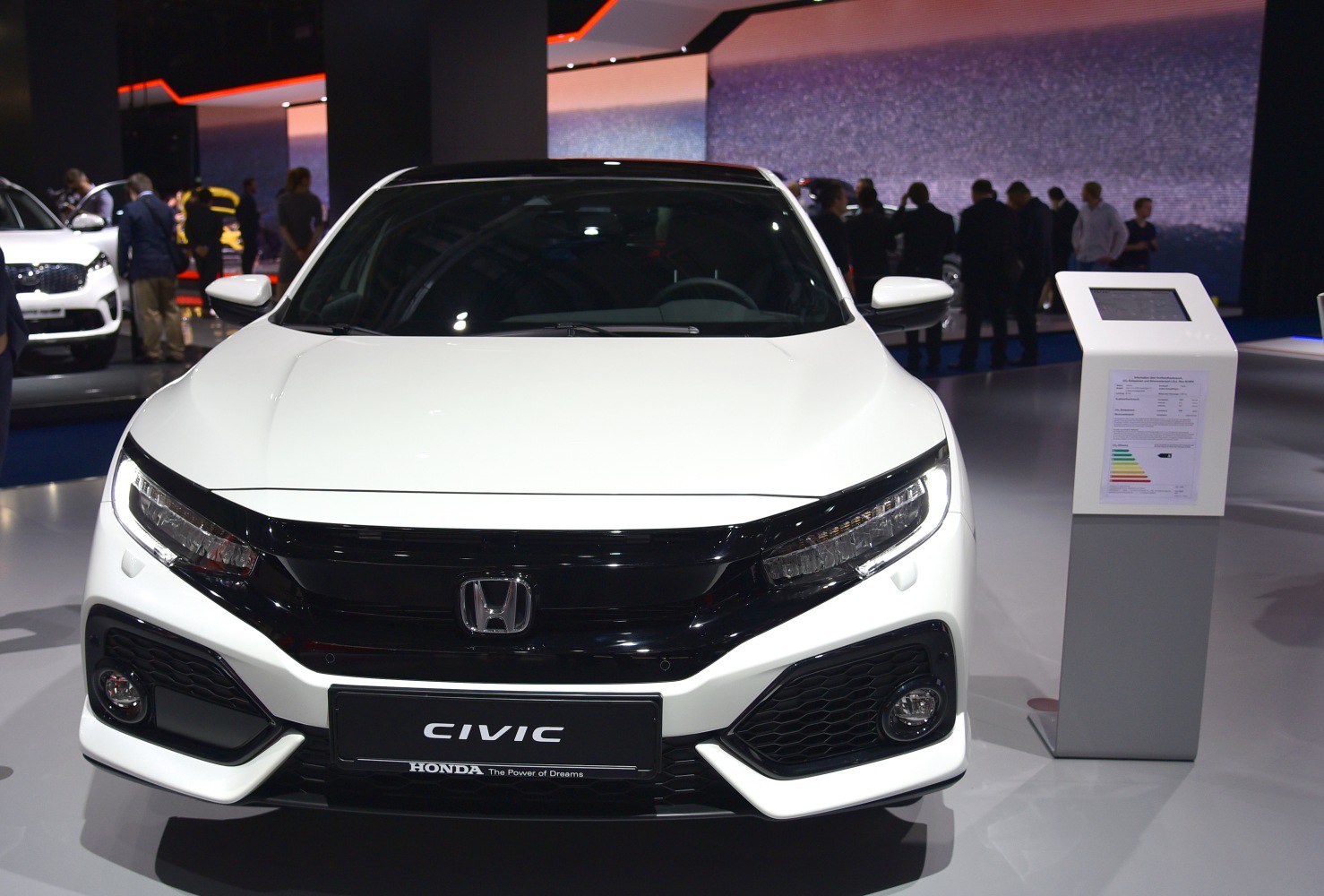 Front view with LED headlights and black grille of a modern hatchback