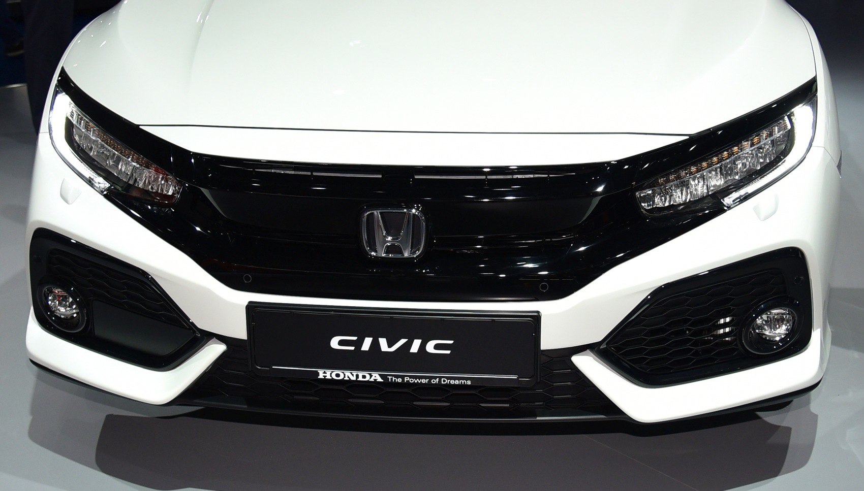 Front view with sleek headlights and bold grille design
