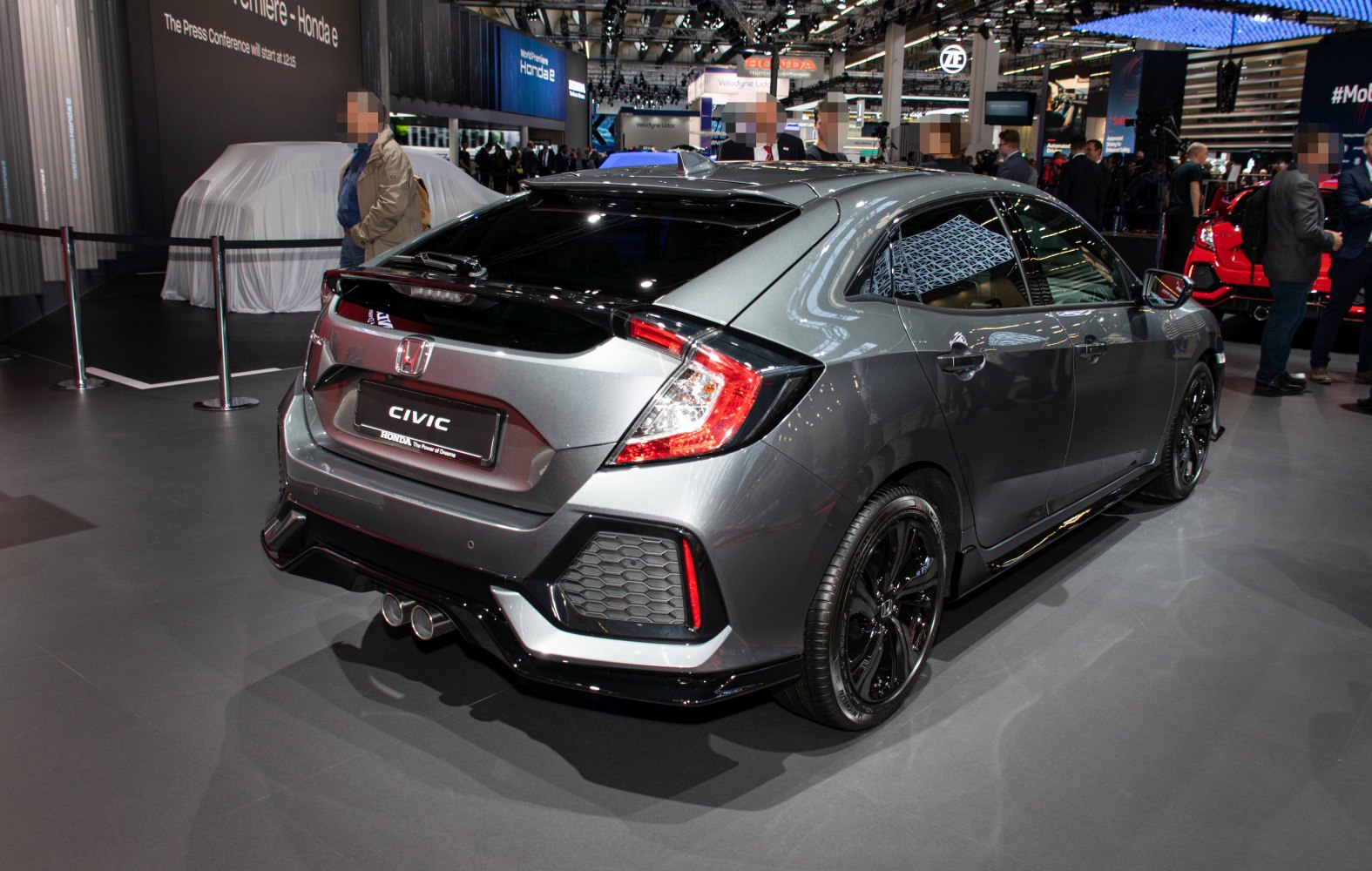 Rear view hatchback with dual exhaust and sporty tail lights