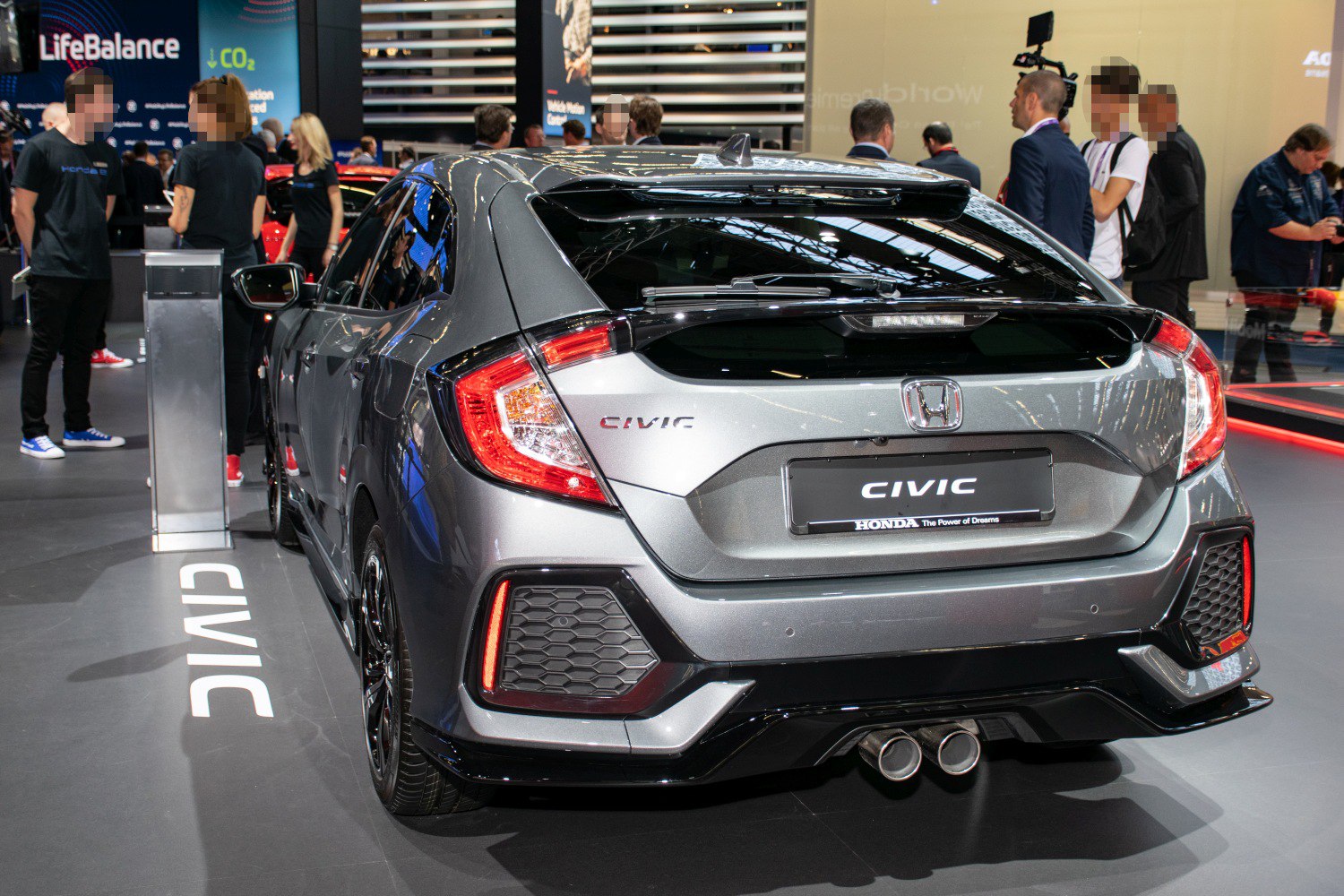 Rear hatchback view with LED tail lights and dual exhaust pipes