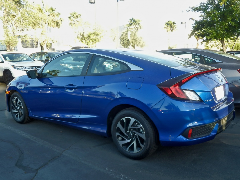 Blue two-door coupe with sleek rear design and alloy wheels