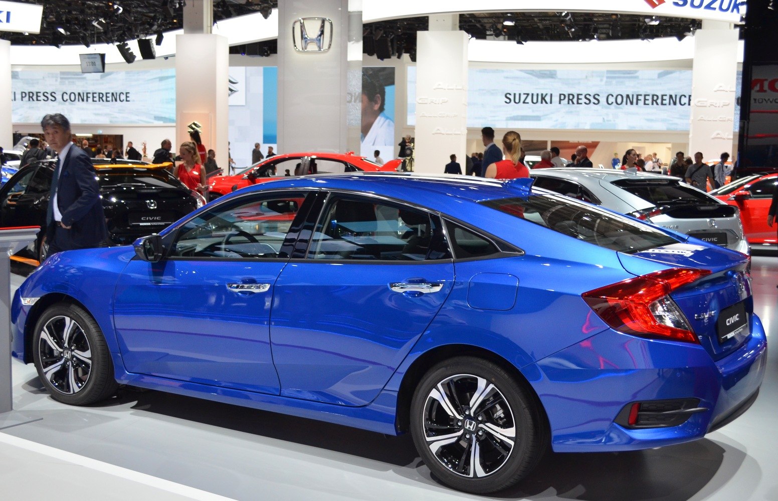 Blue sedan with alloy wheels and sharp sporty side profile
