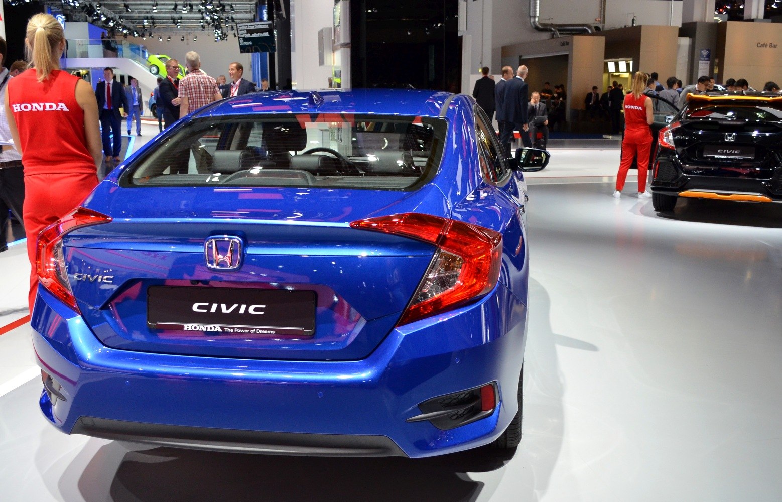 Rear view of blue hatchback with angular taillights and sporty rear design