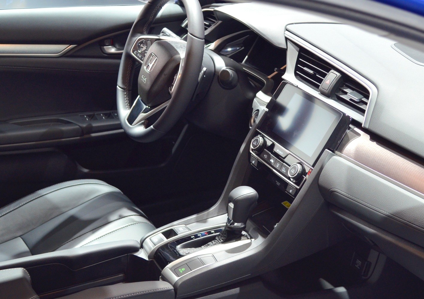 Dashboard with touchscreen and gear shift console in modern car interior