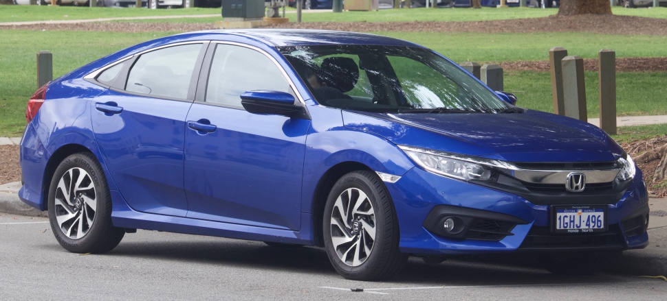 Blue sedan front-side profile with modern headlights and alloy wheels