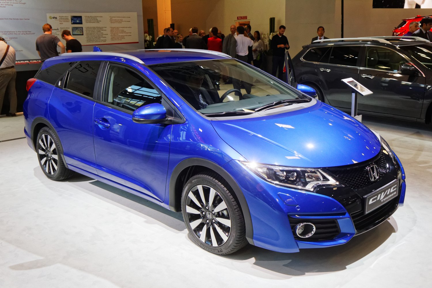 Blue station wagon with sporty grille and alloy wheels