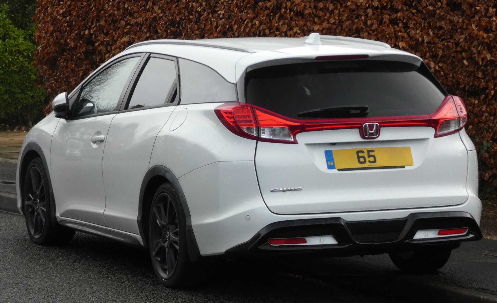 Rear view with distinctive tail lights and sporty rear diffuser