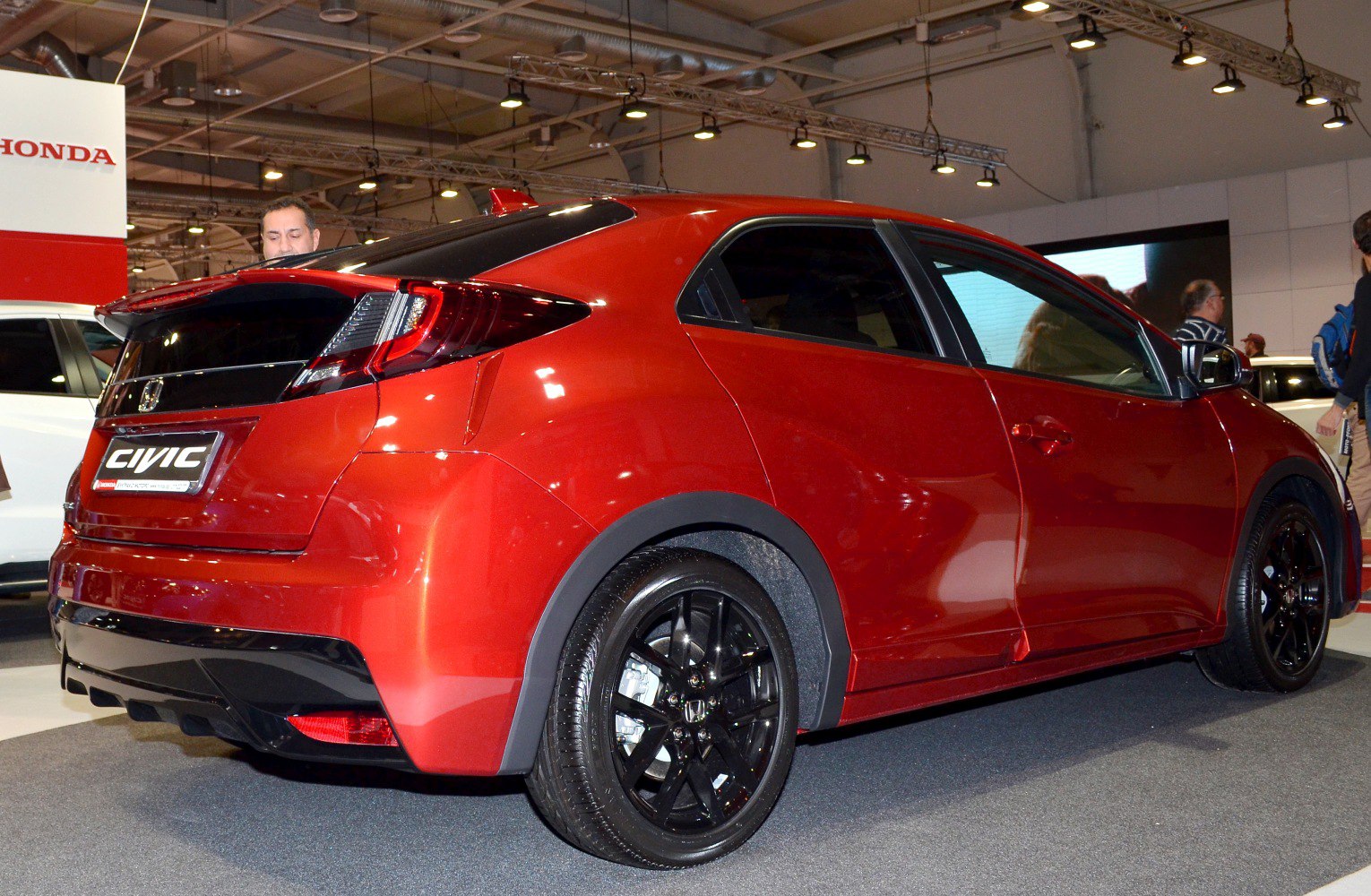 Rear-angle hatchback with black rims and distinctive taillights
