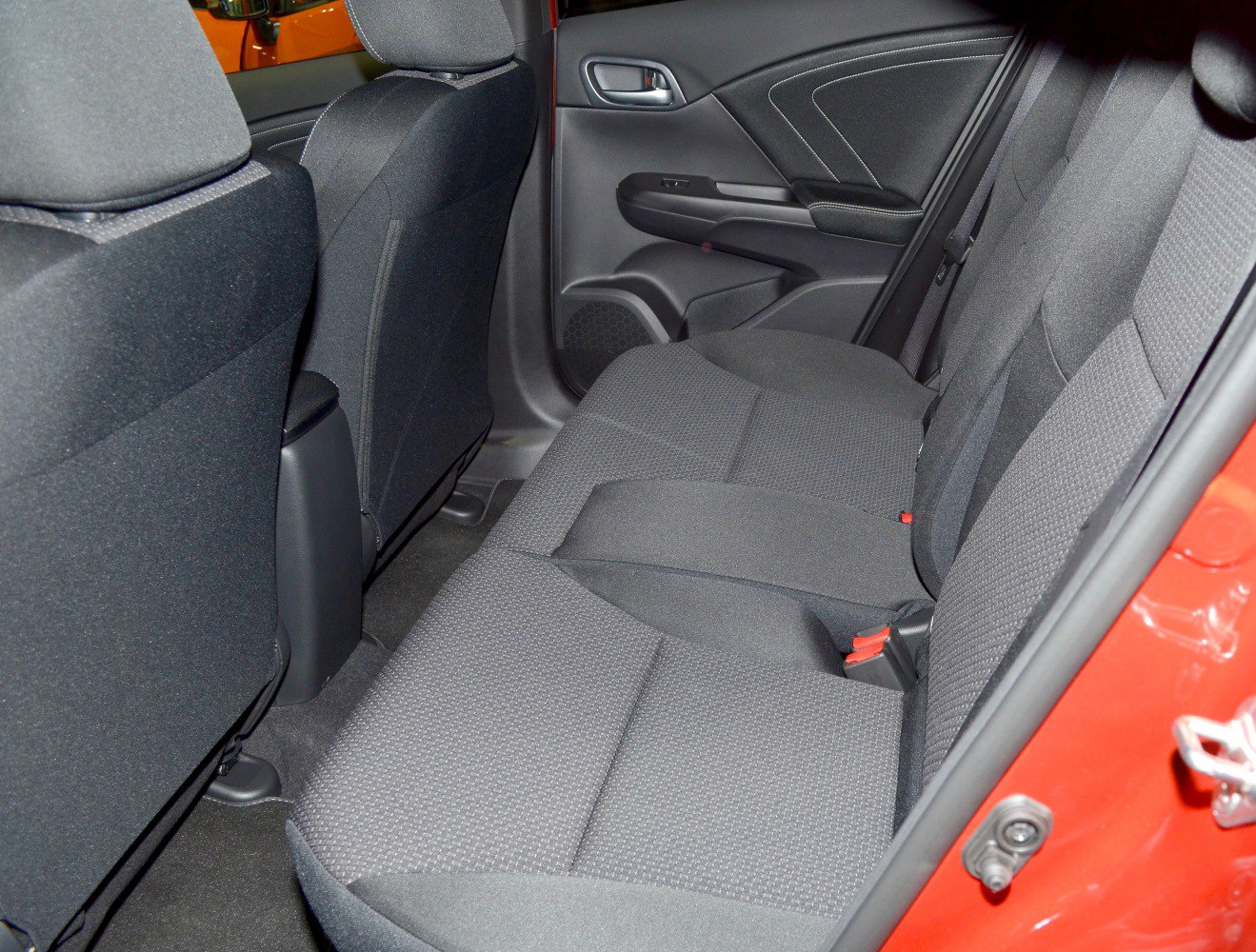 Rear fabric seats and door panel interior of a hatchback car