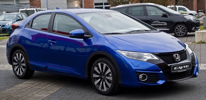 Front side view with headlights and alloy wheels