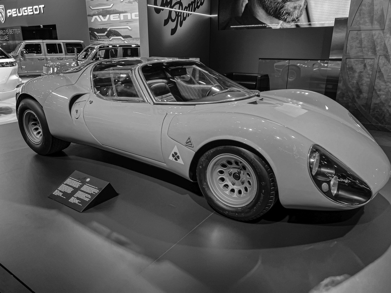 Aerodynamic sports car body with iconic headlights and retro wheels