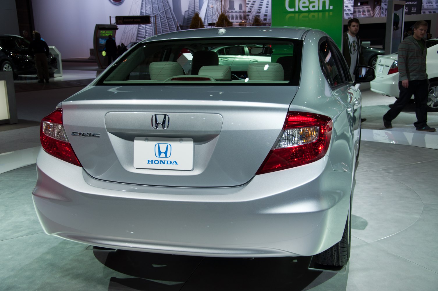 Rear view with trunk design and taillights of a modern sedan.