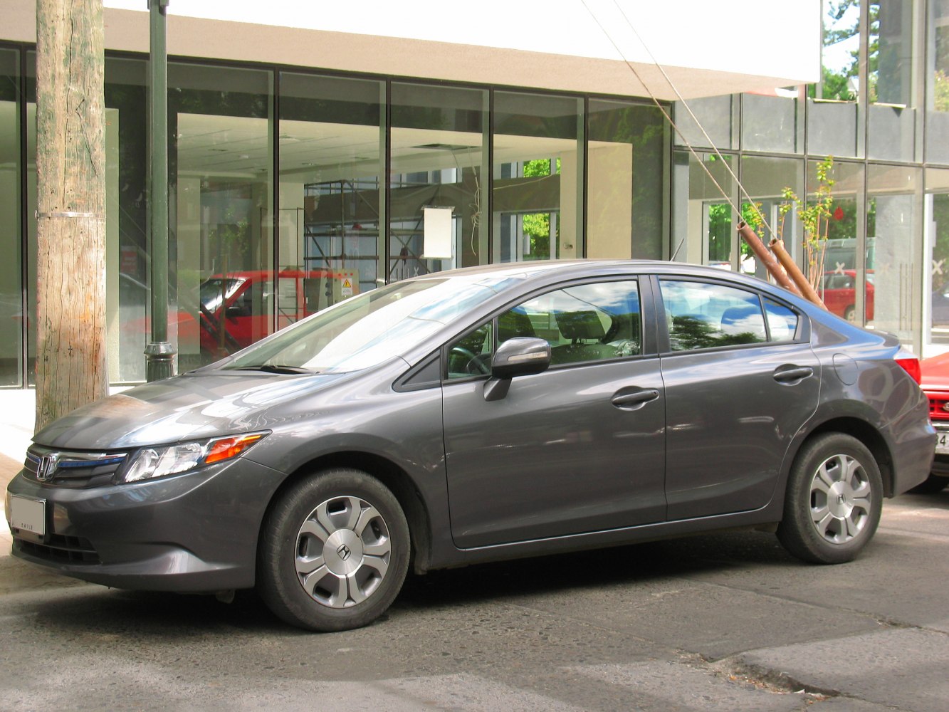 Sleek side profile of a compact sedan with aerodynamic design and clean lines.