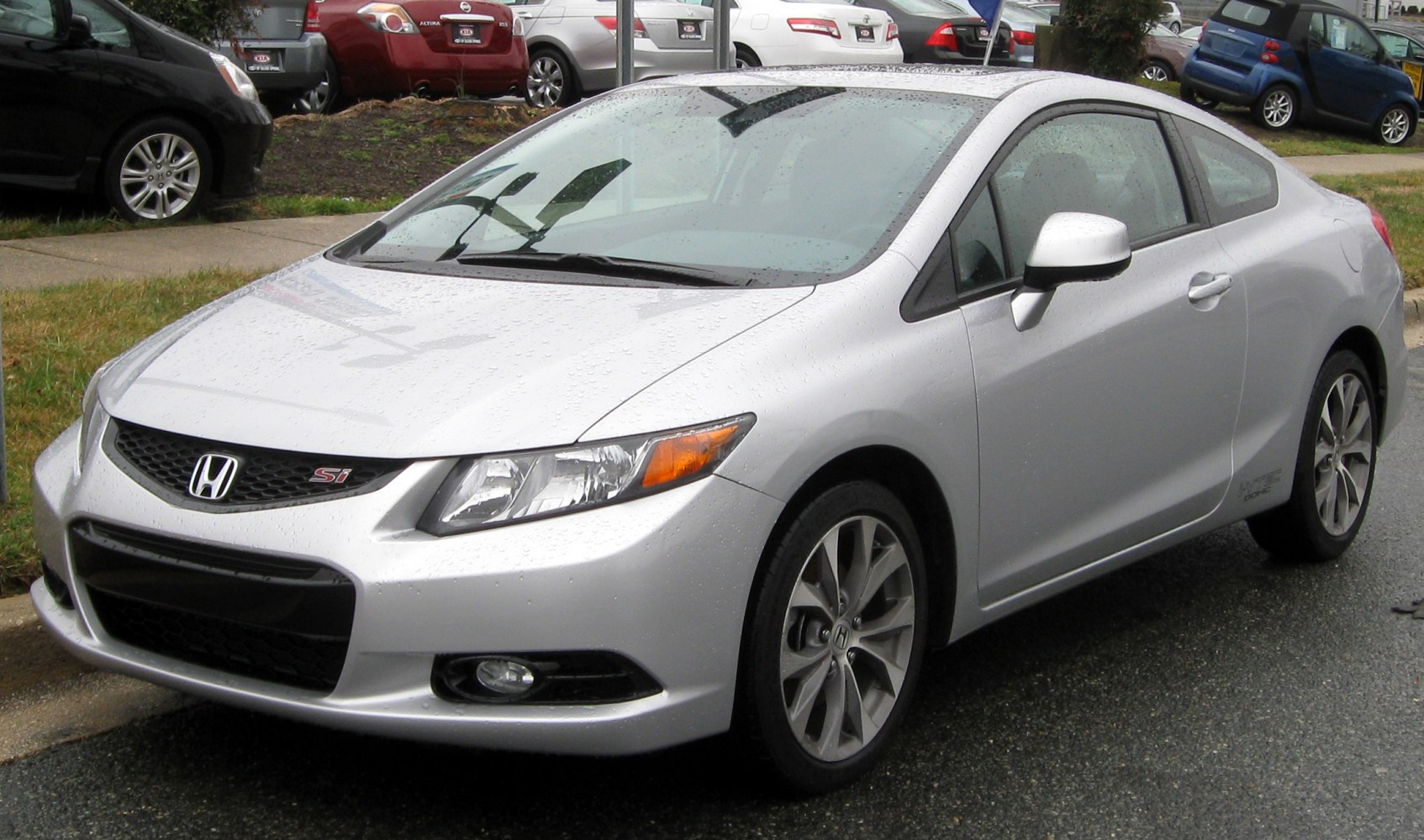 Silver coupe with sporty front design and alloy wheels