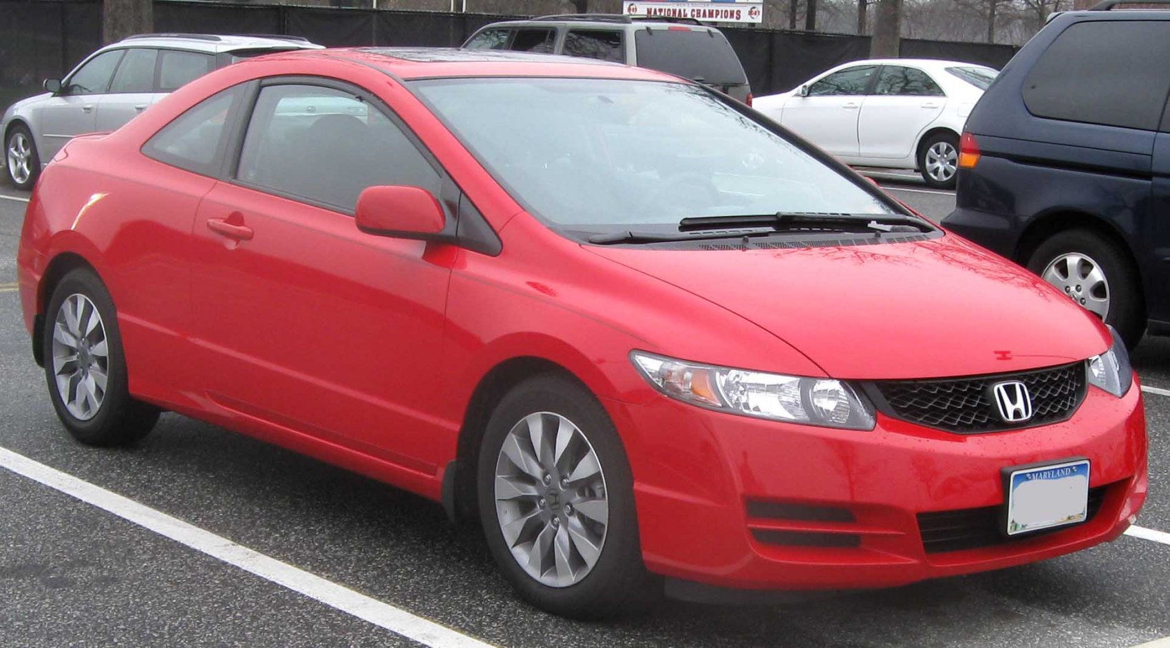 Front-side view of a red coupe with alloy wheels