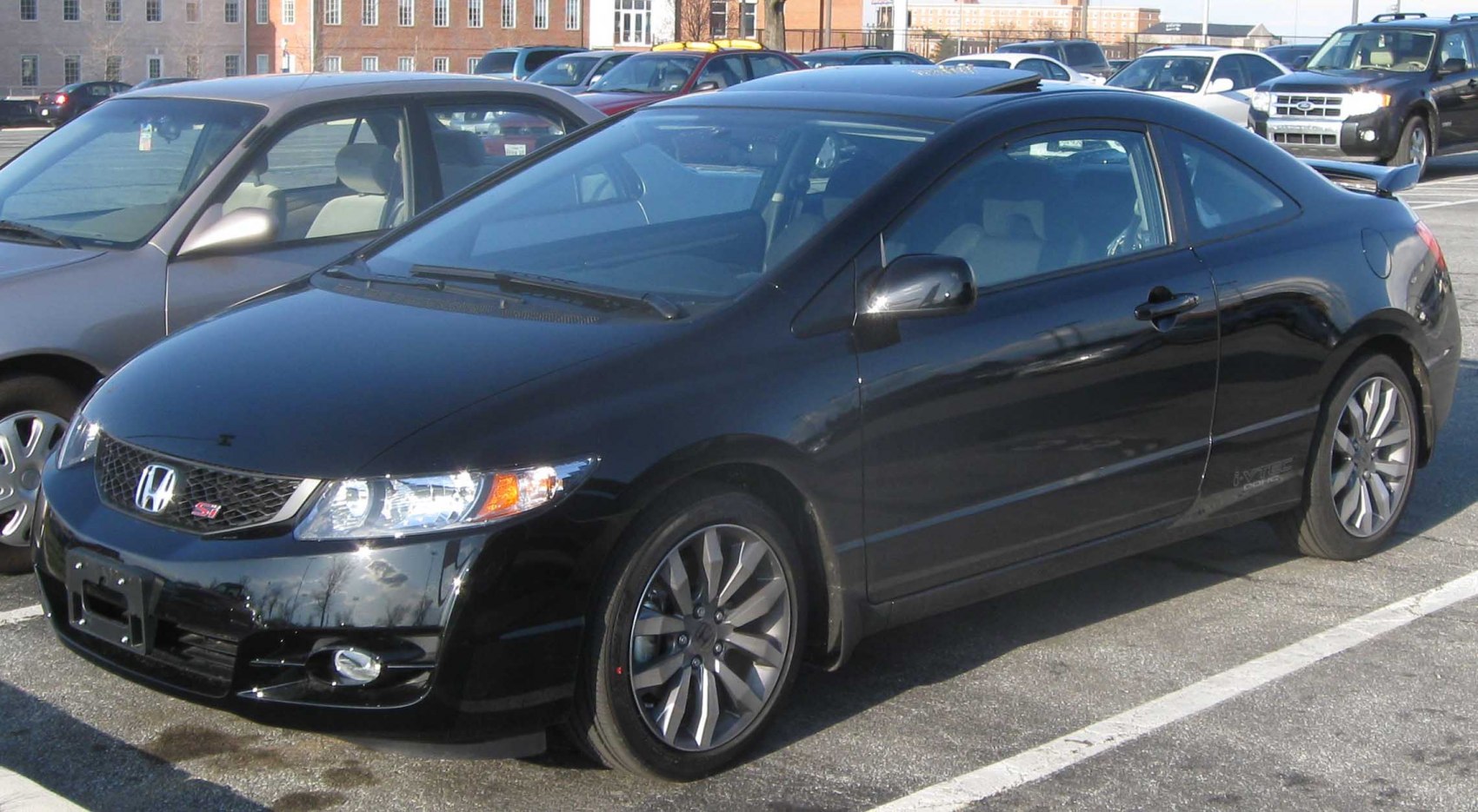 Black coupe with sporty front side view and distinct wheels
