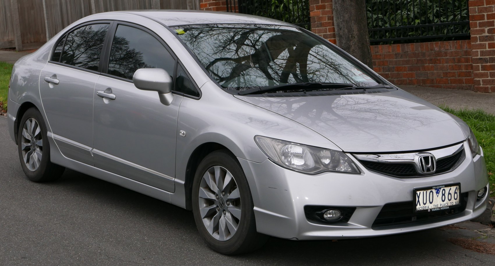 Silver sedan with angular headlights and alloy wheels