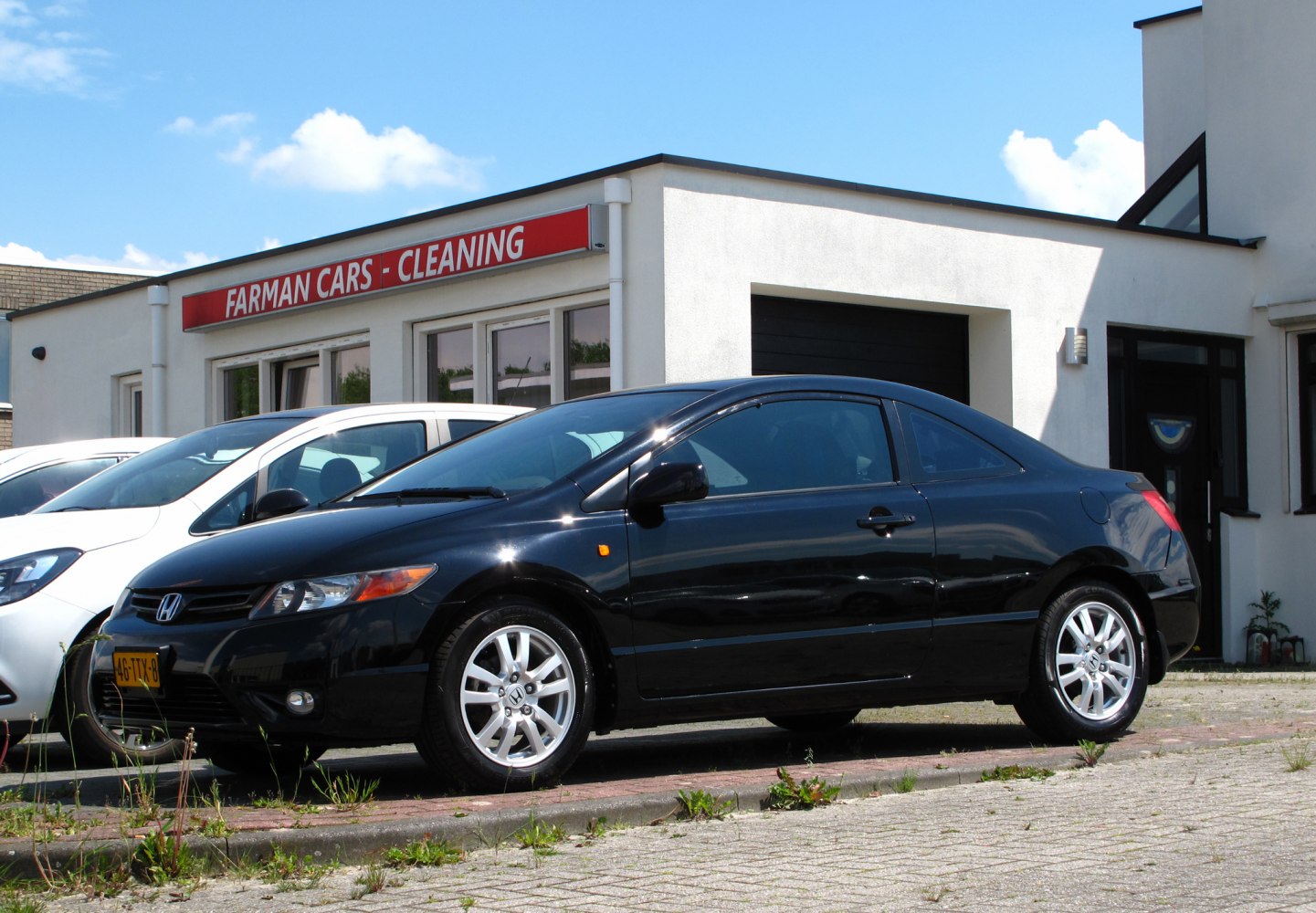 Sleek coupe side profile with alloy wheels