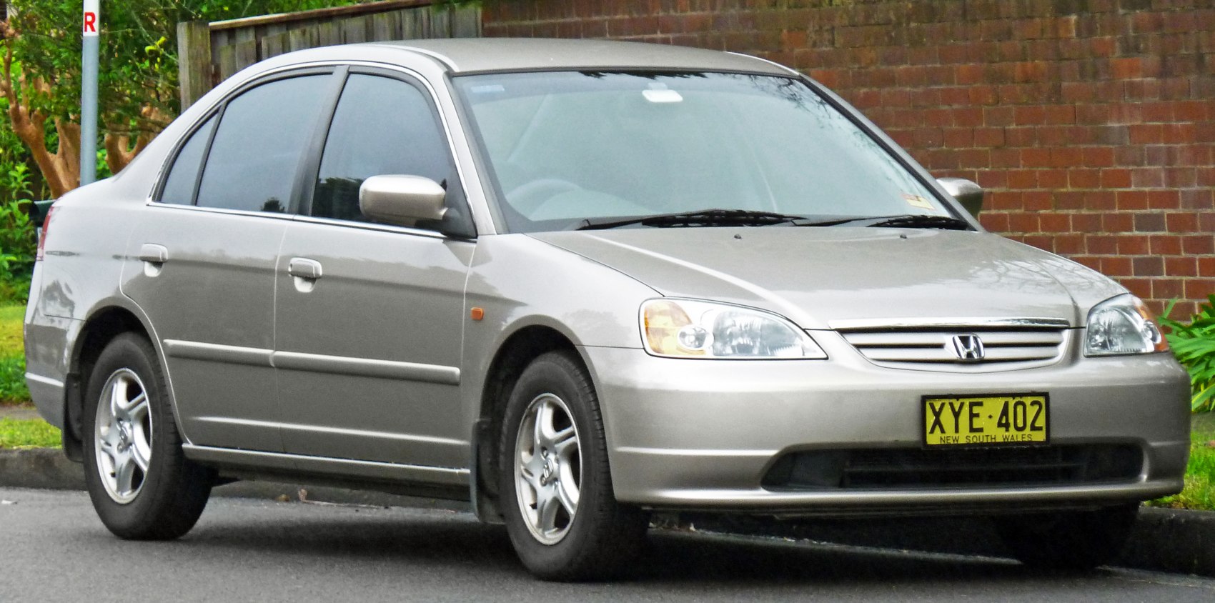Front side view of sedan with alloy wheels