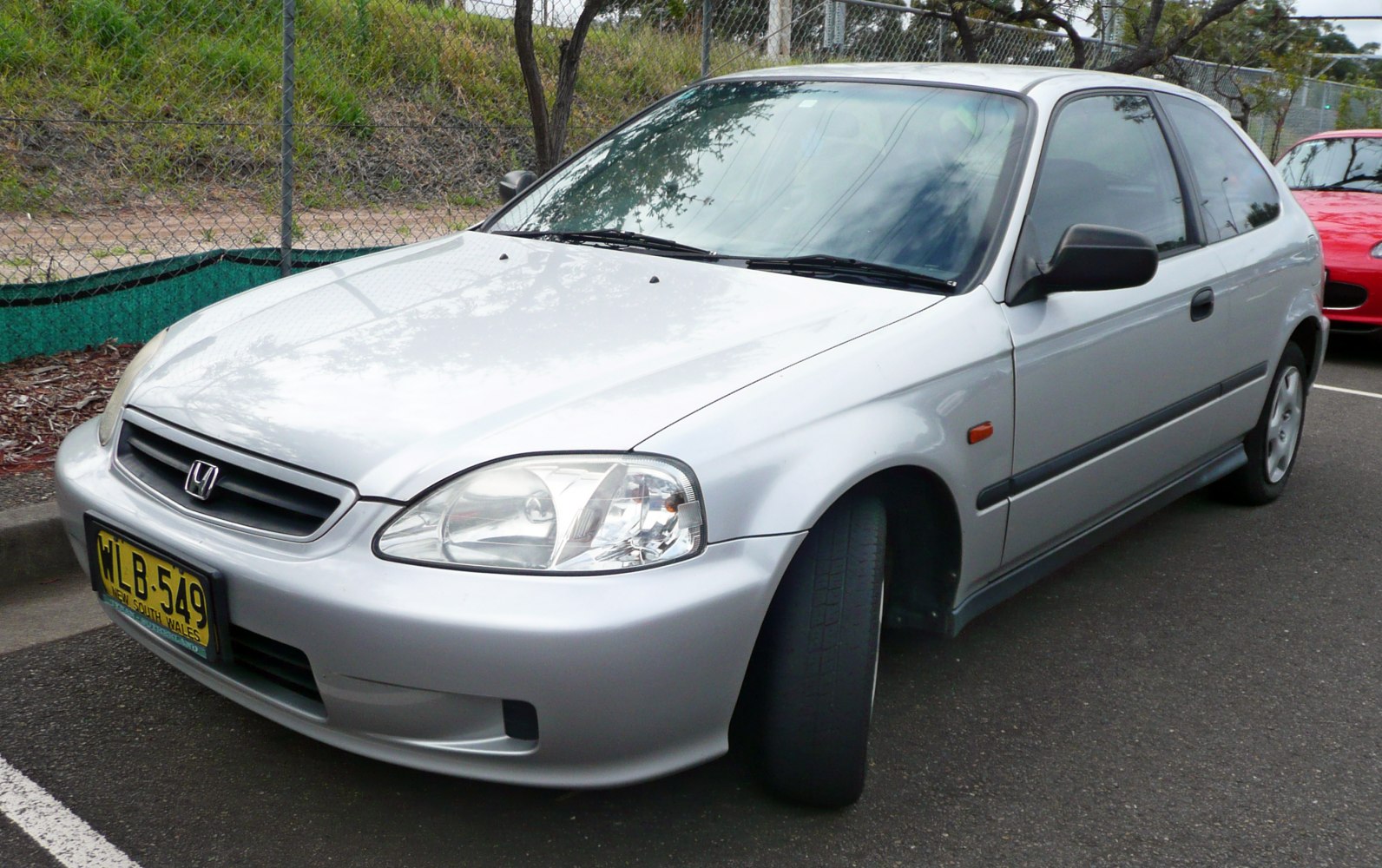silver hatchback with distinct headlights and grille