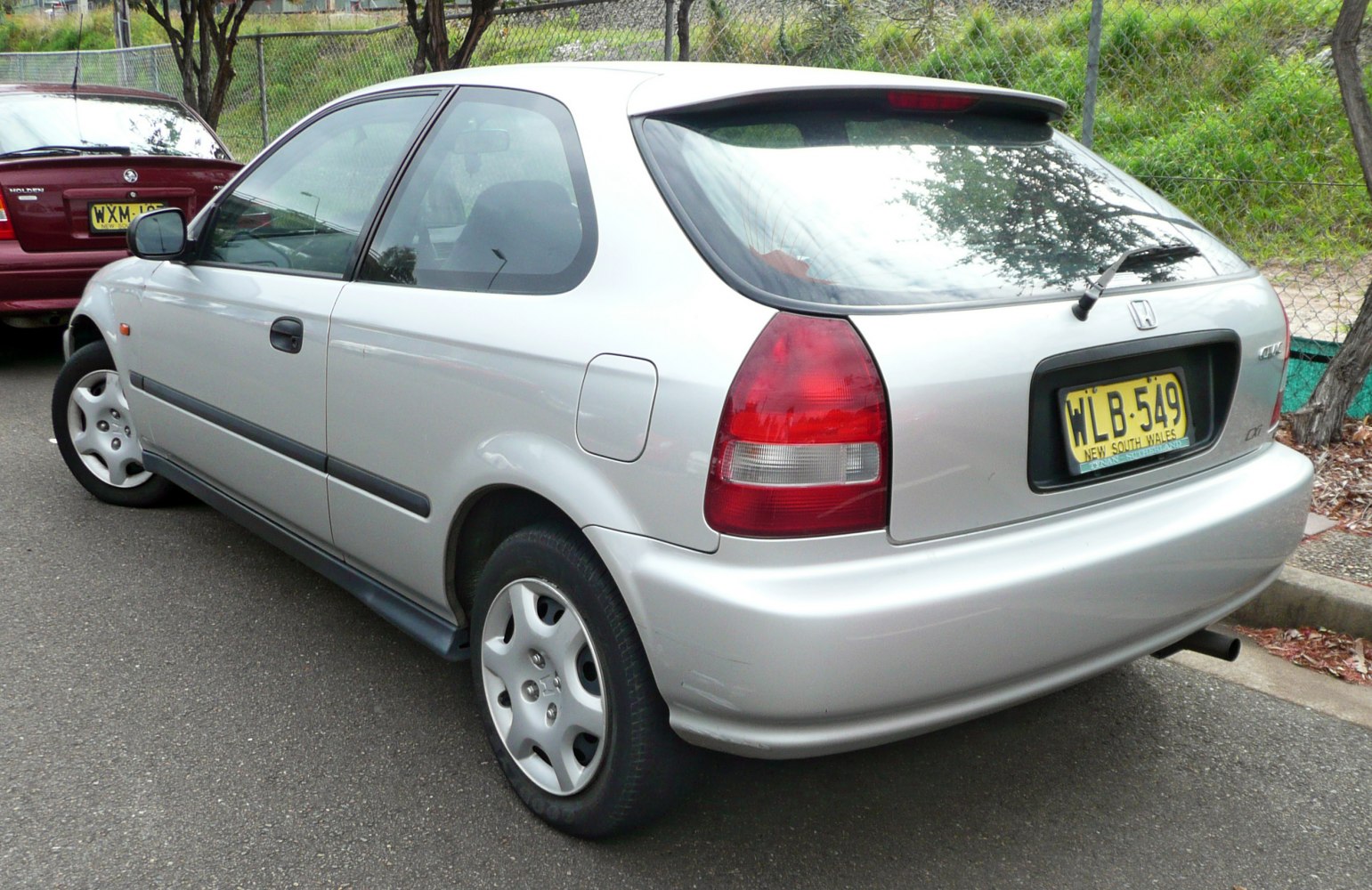 Silver 3-door hatchback rear and side view with alloy wheels and rear wiper