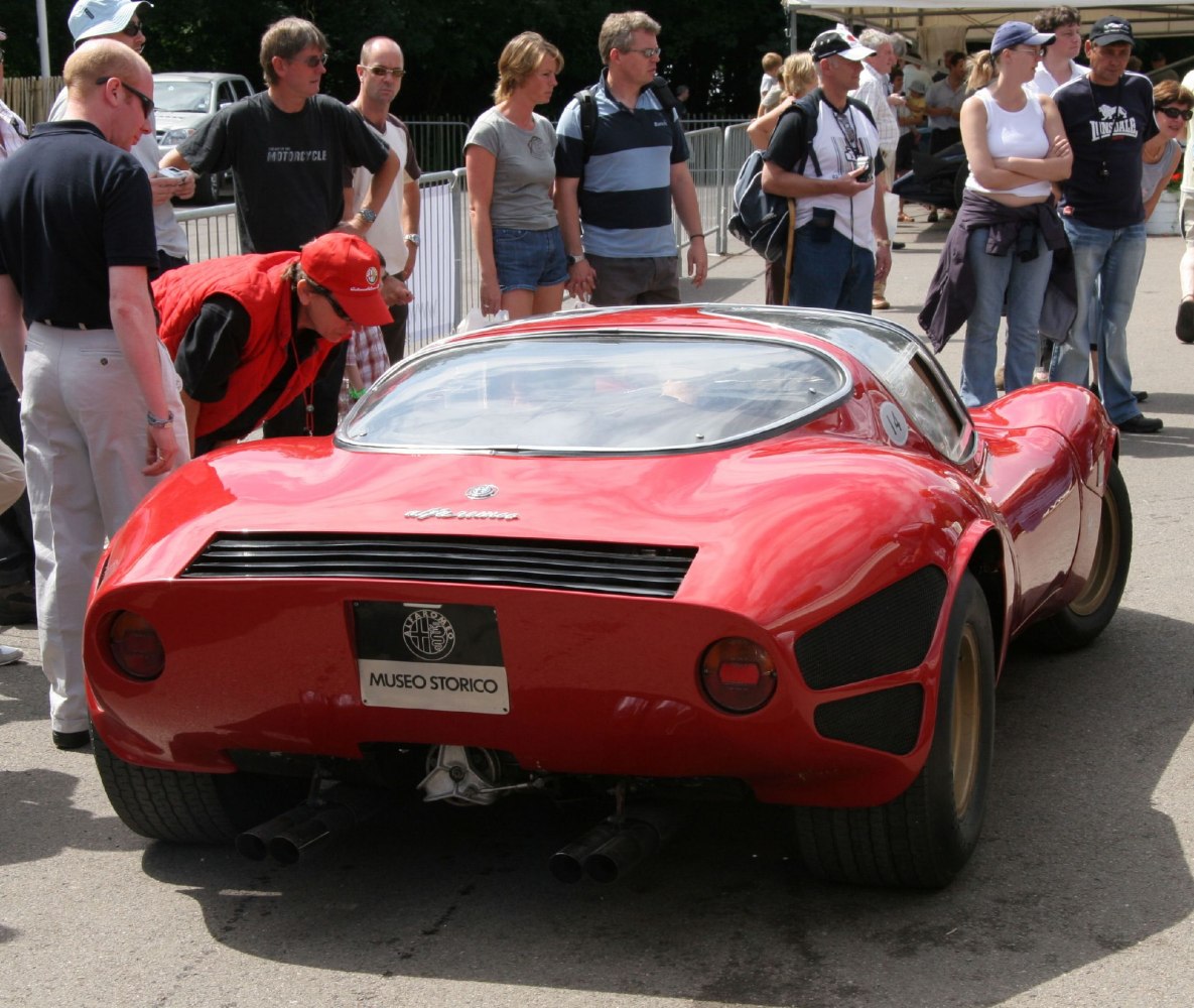 Rear view of classic streamlined sports car with dual exhaust pipes