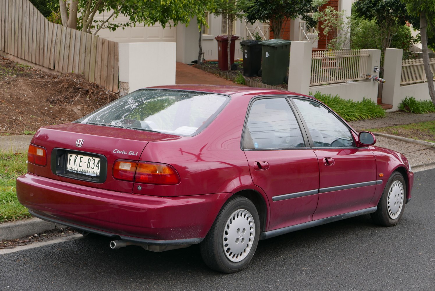 Rear side view of classic sedan with alloy wheels