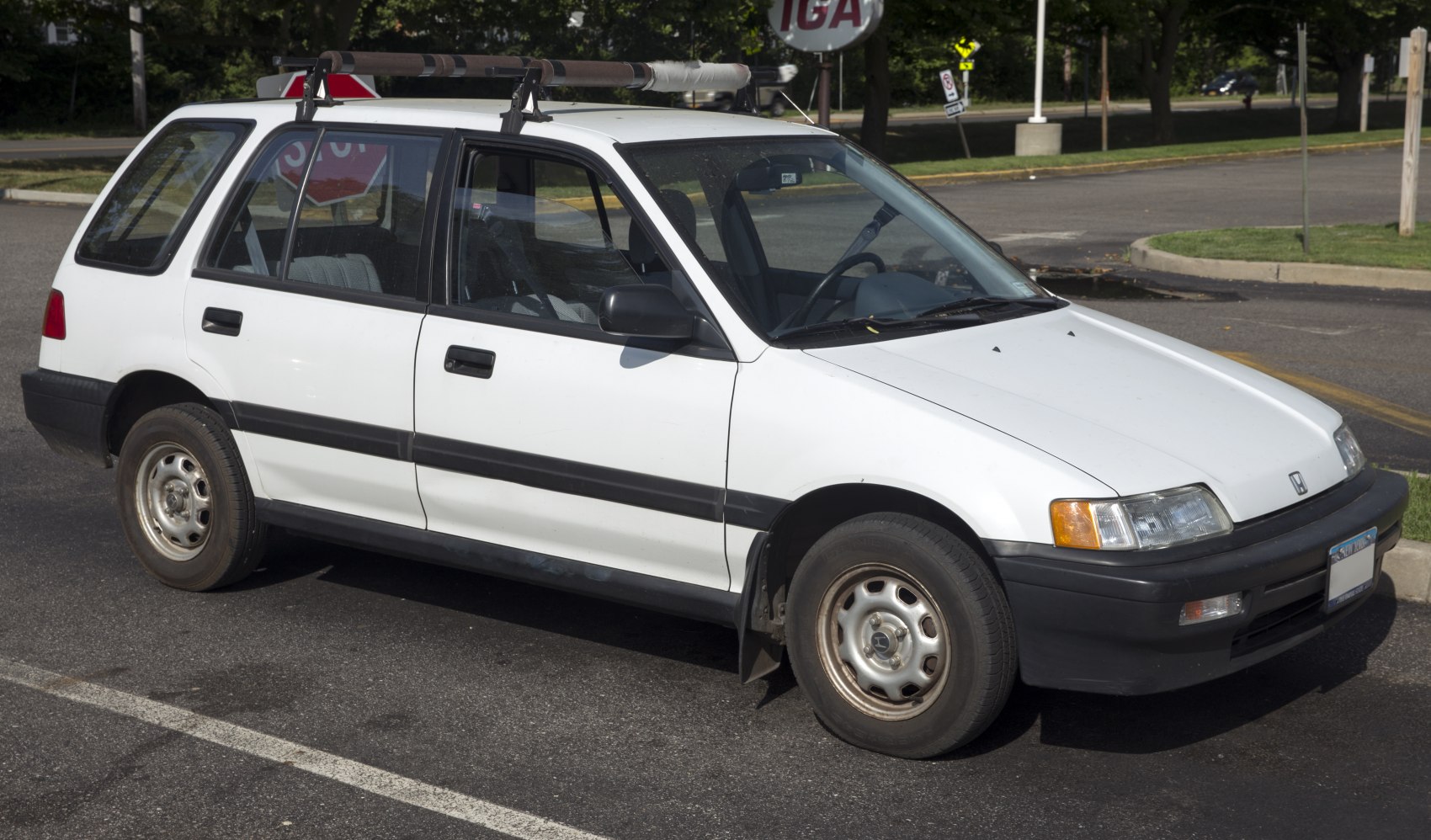White wagon with roof rack and boxy 1980s design