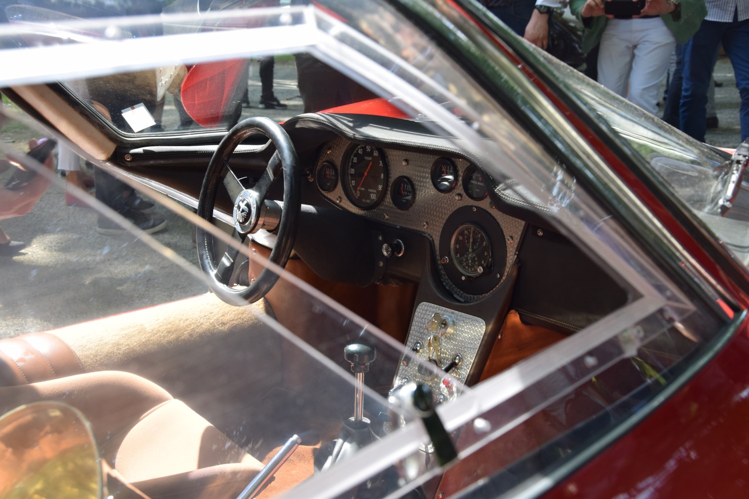 Vintage sports car interior with round gauges and steering wheel