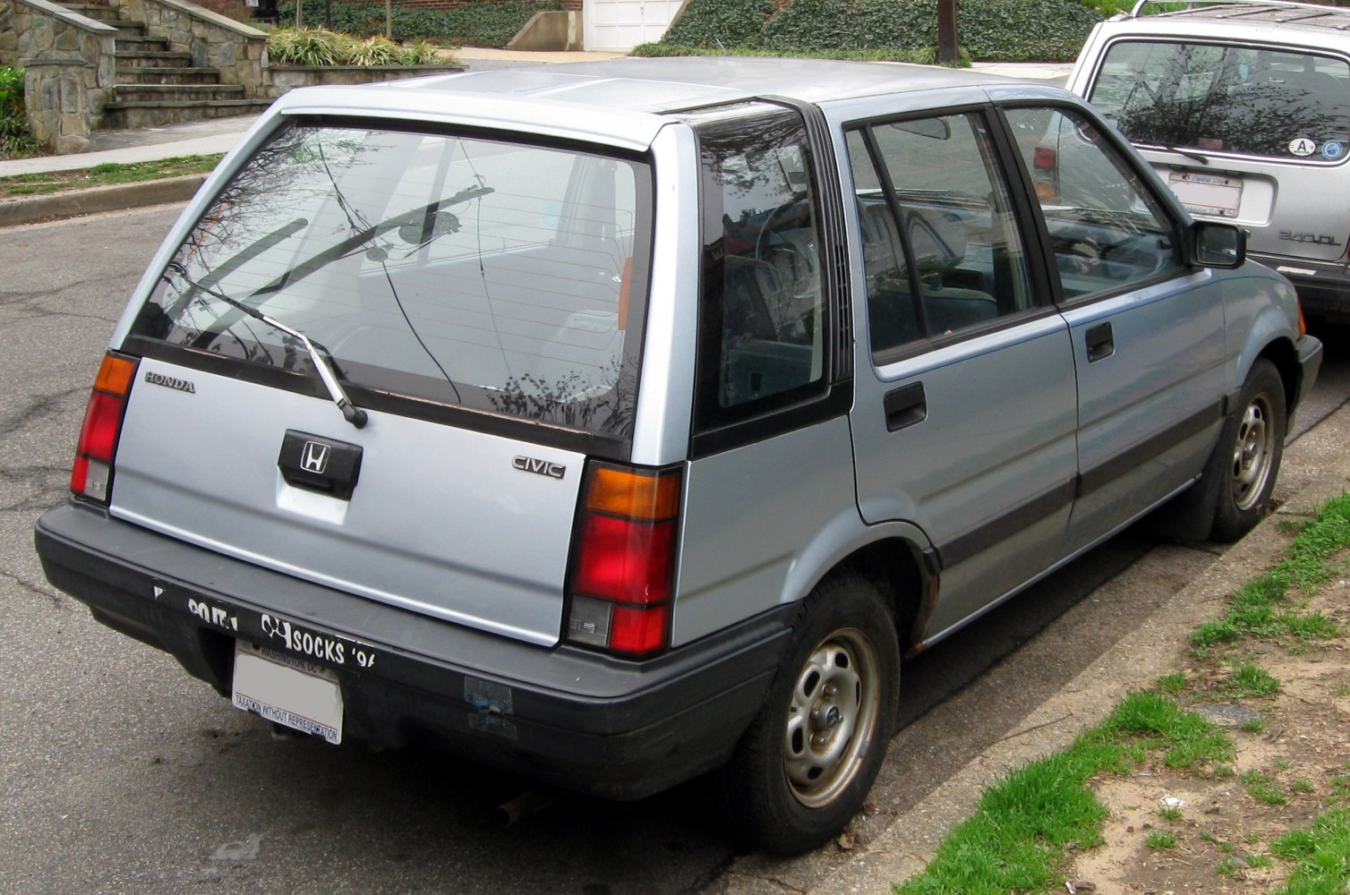 Boxy rear side view of classic vintage wagon with large rear window and hatchback design