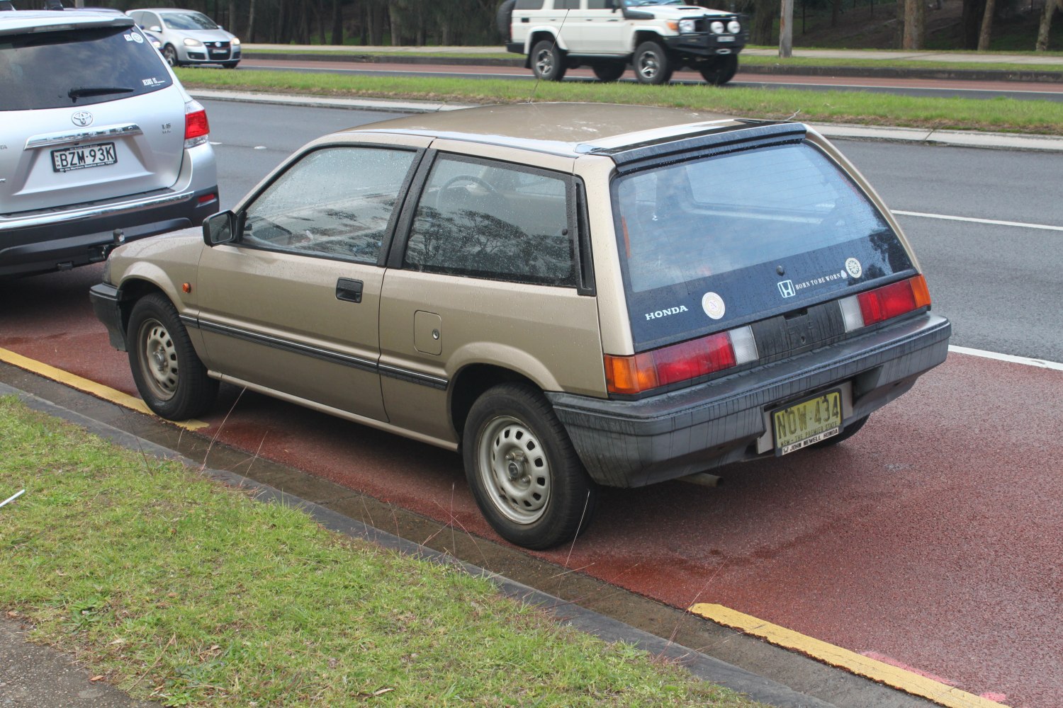 Rear side view of vintage compact hatchback with 1980s design features