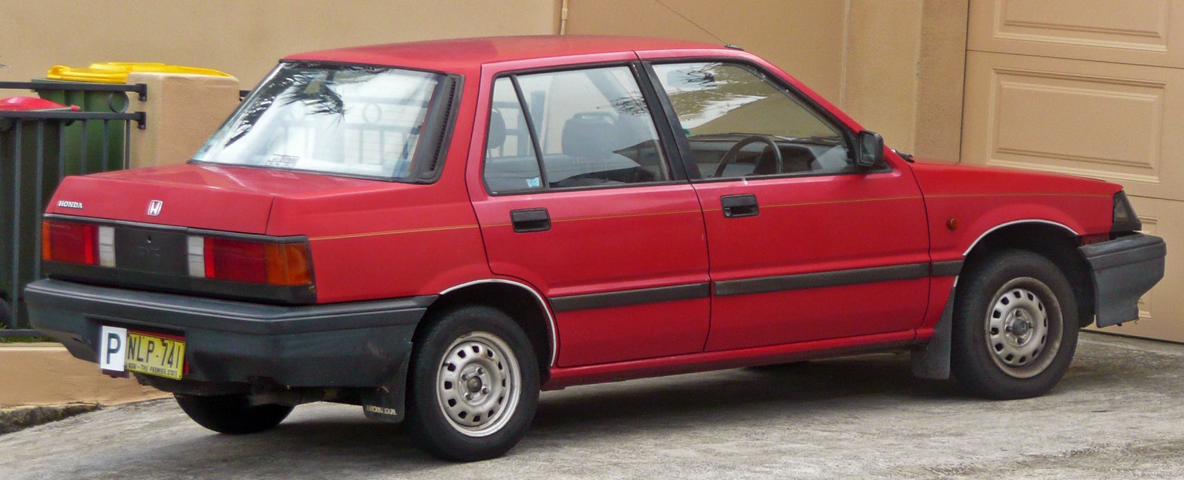 Classic hatchback side view with boxy design and compact profile