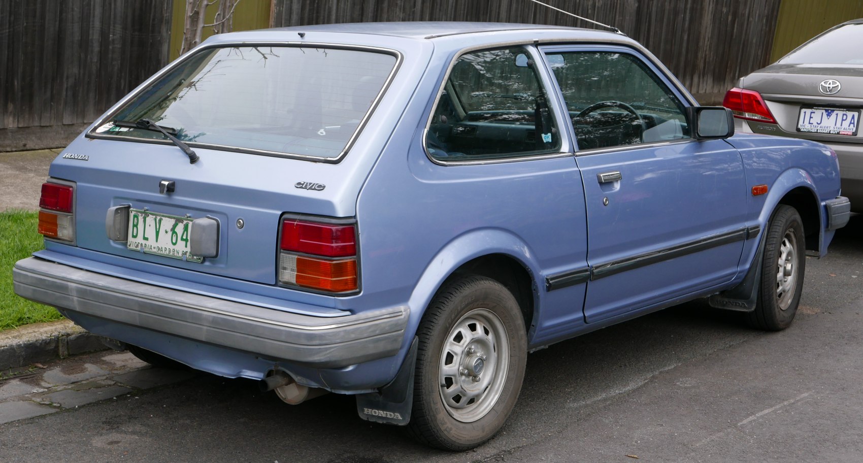Rear and side view of classic 1980s hatchback with vintage design details