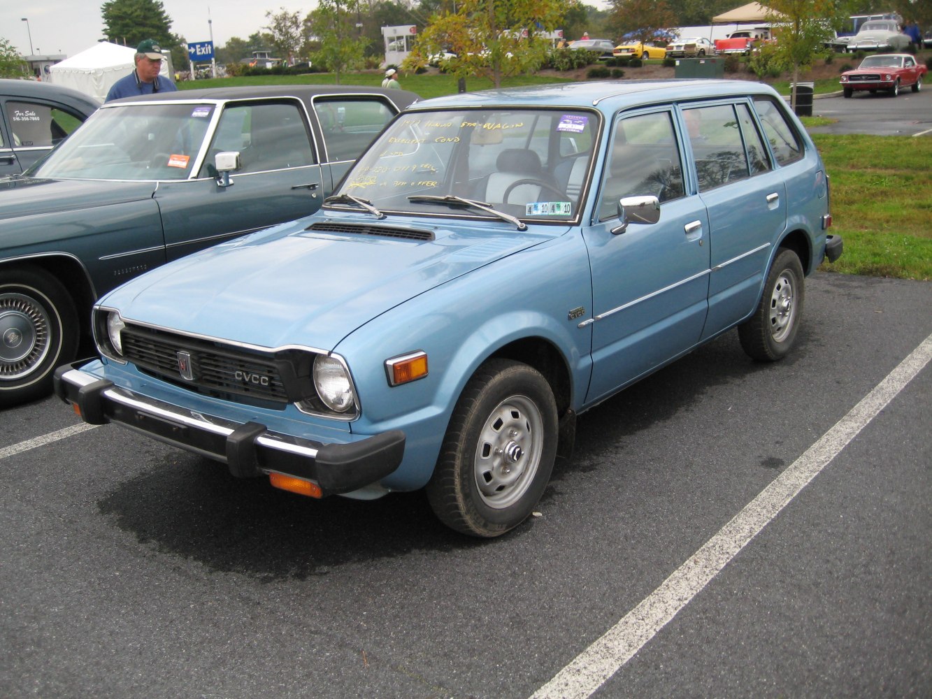 Vintage compact wagon with square headlights and black bumper