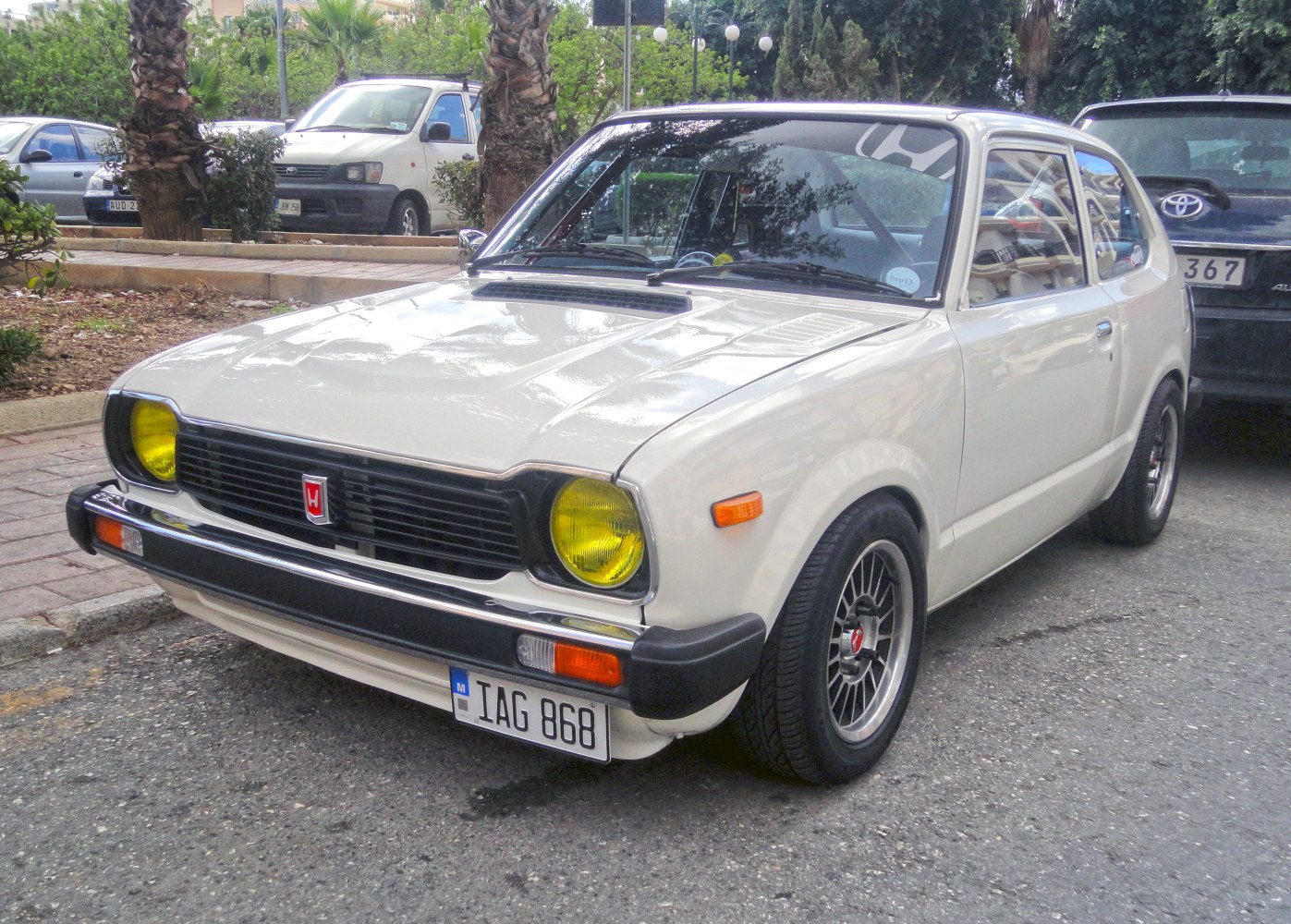 Front view of 1970s compact hatchback with yellow headlights and sporty wheels