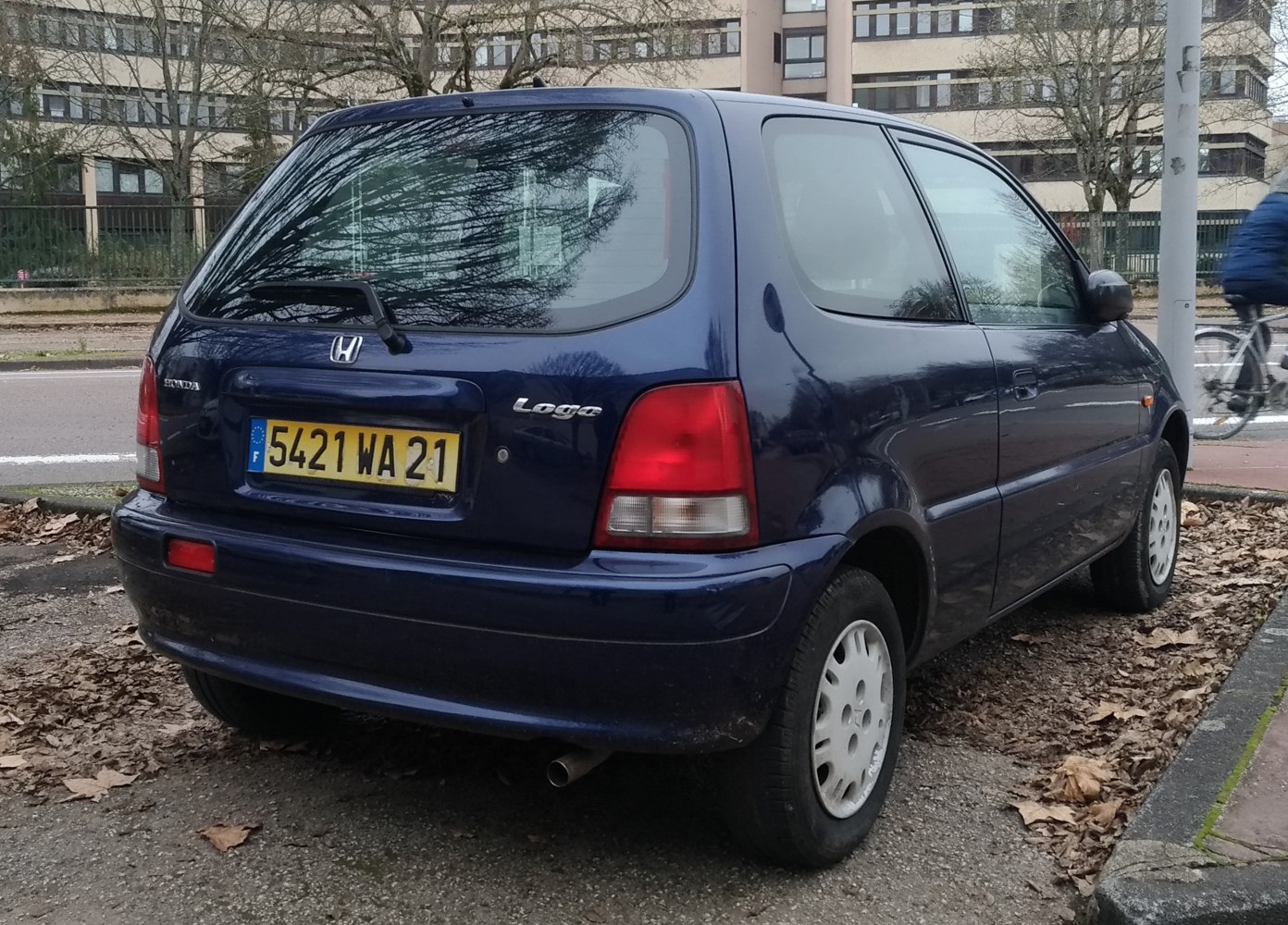 Rear and side profile of a compact hatchback with distinctive taillights and hatchback design