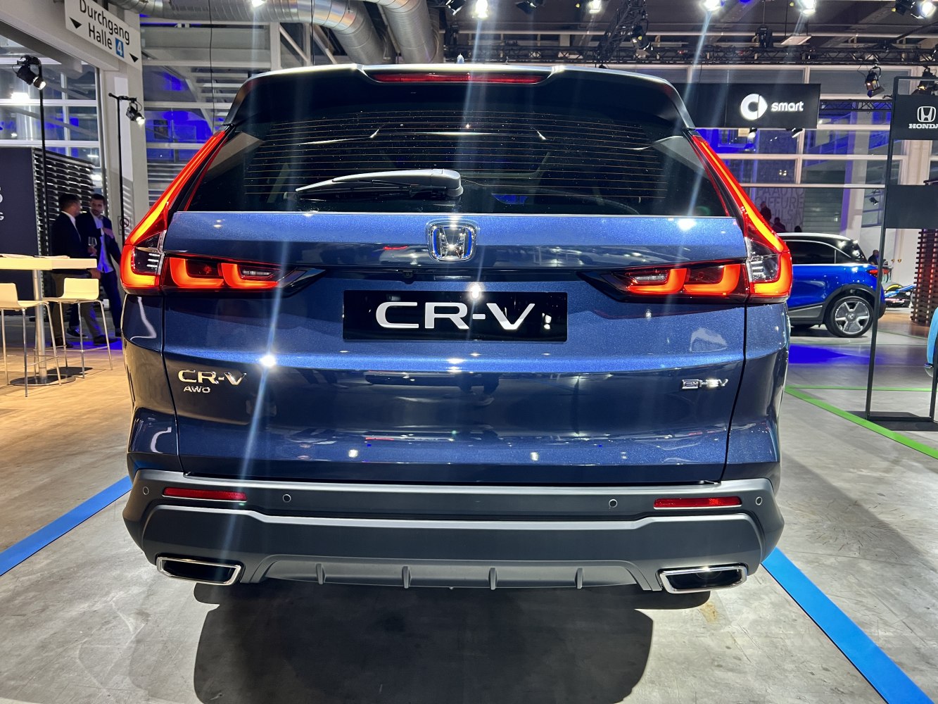 Rear view featuring LED tail lights and dual exhaust of modern SUV