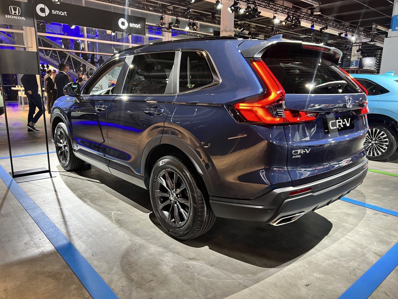Rear side profile with distinctive LED taillights and modern design.