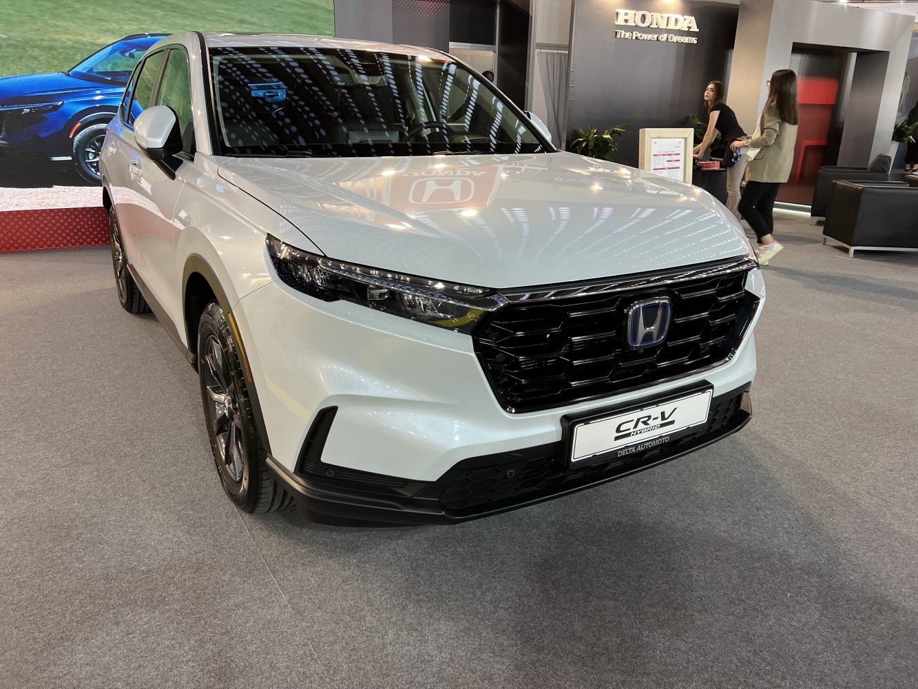 Front view with sleek LED headlights and bold black hexagonal grille