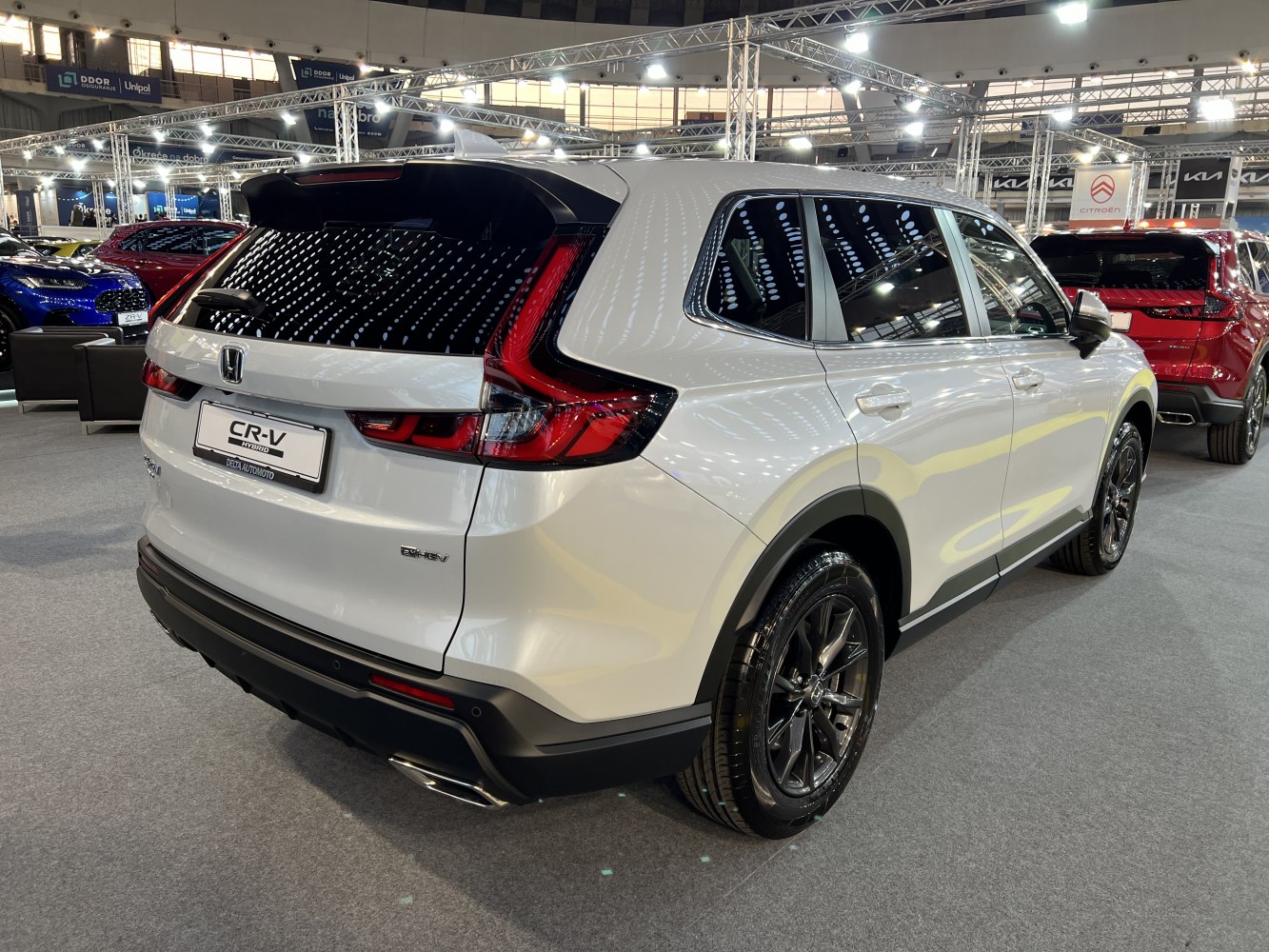 Rear and side view of a hybrid SUV with LED taillights and black alloy wheels