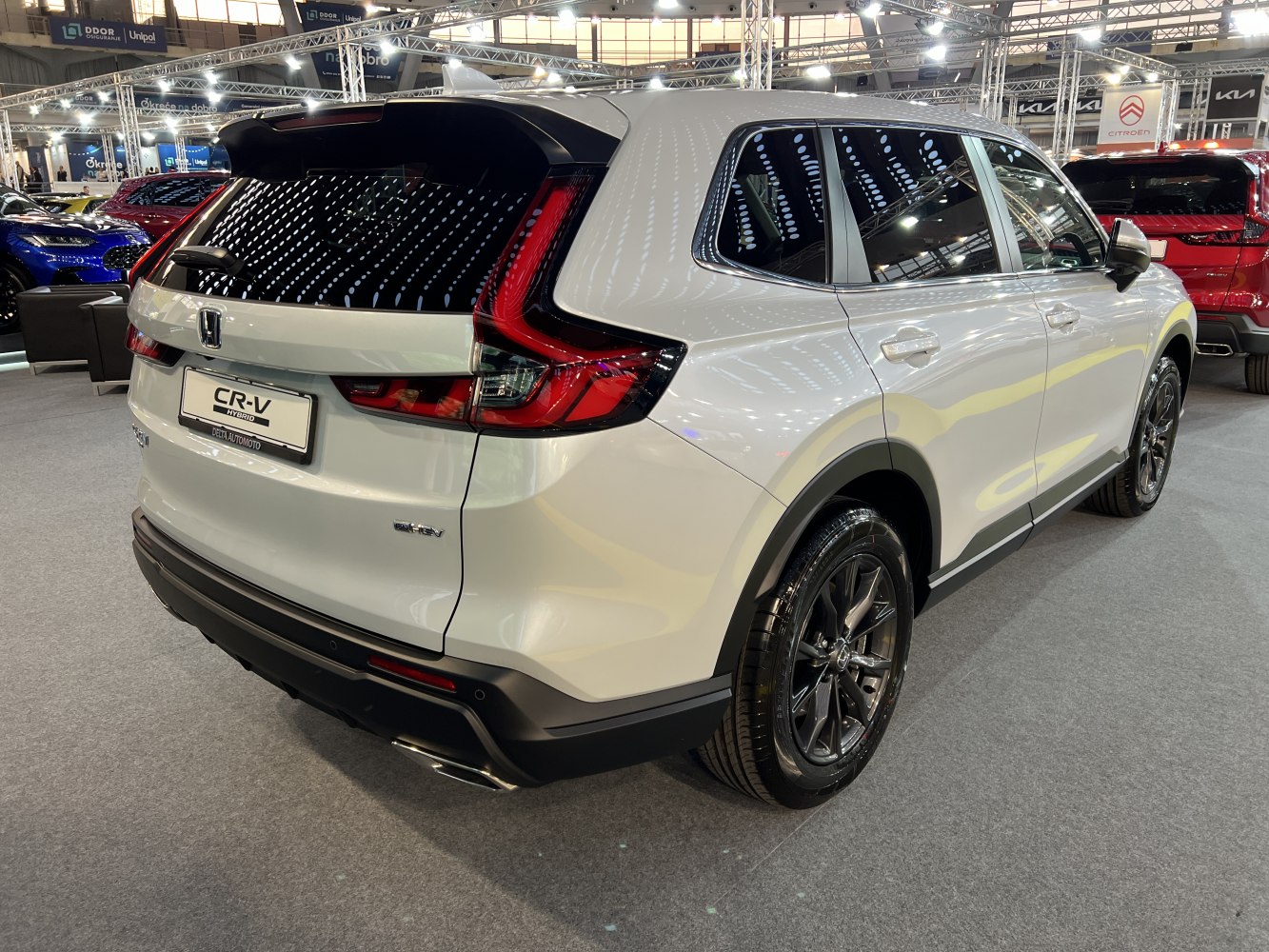 Rear and side view of hybrid SUV with sleek taillights and black alloy wheels