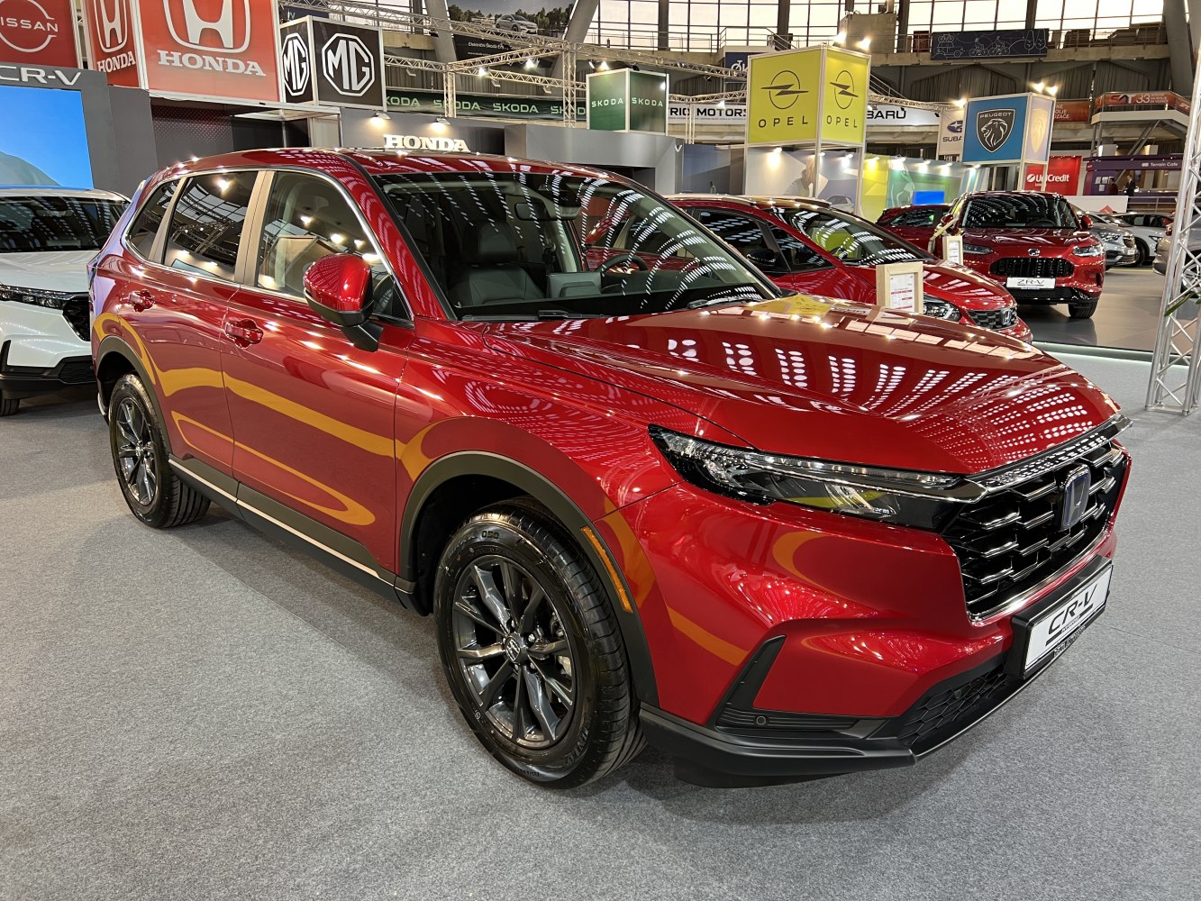 Front and side view of a modern SUV with sharp headlights and sleek design