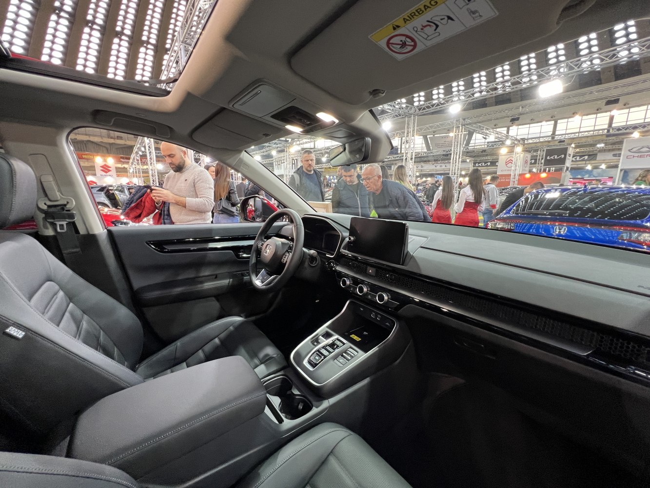 Modern car interior with digital dashboard and leather seats