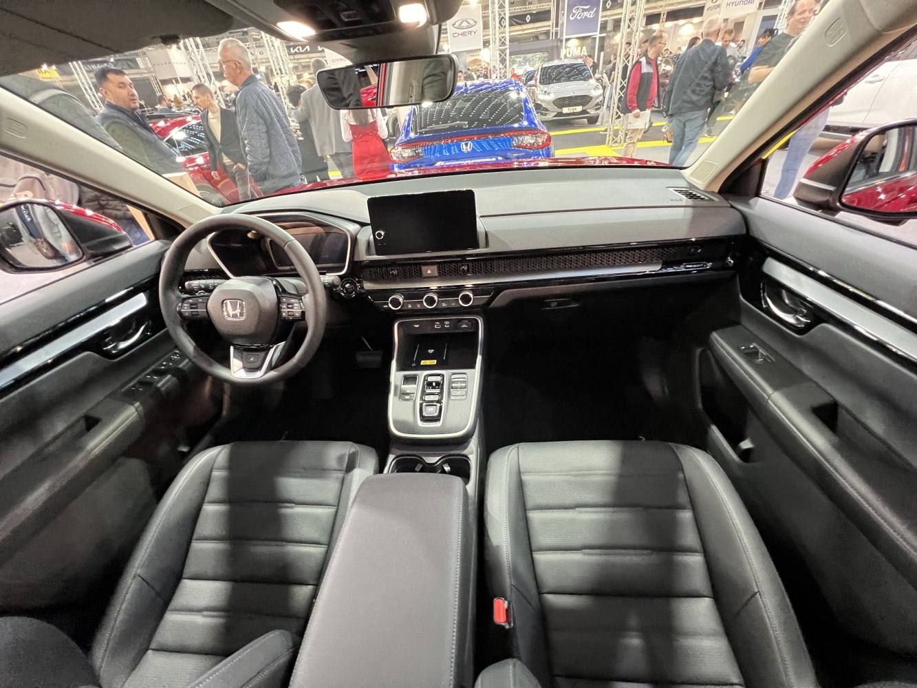 Modern dashboard and infotainment display with ergonomic leather seats
