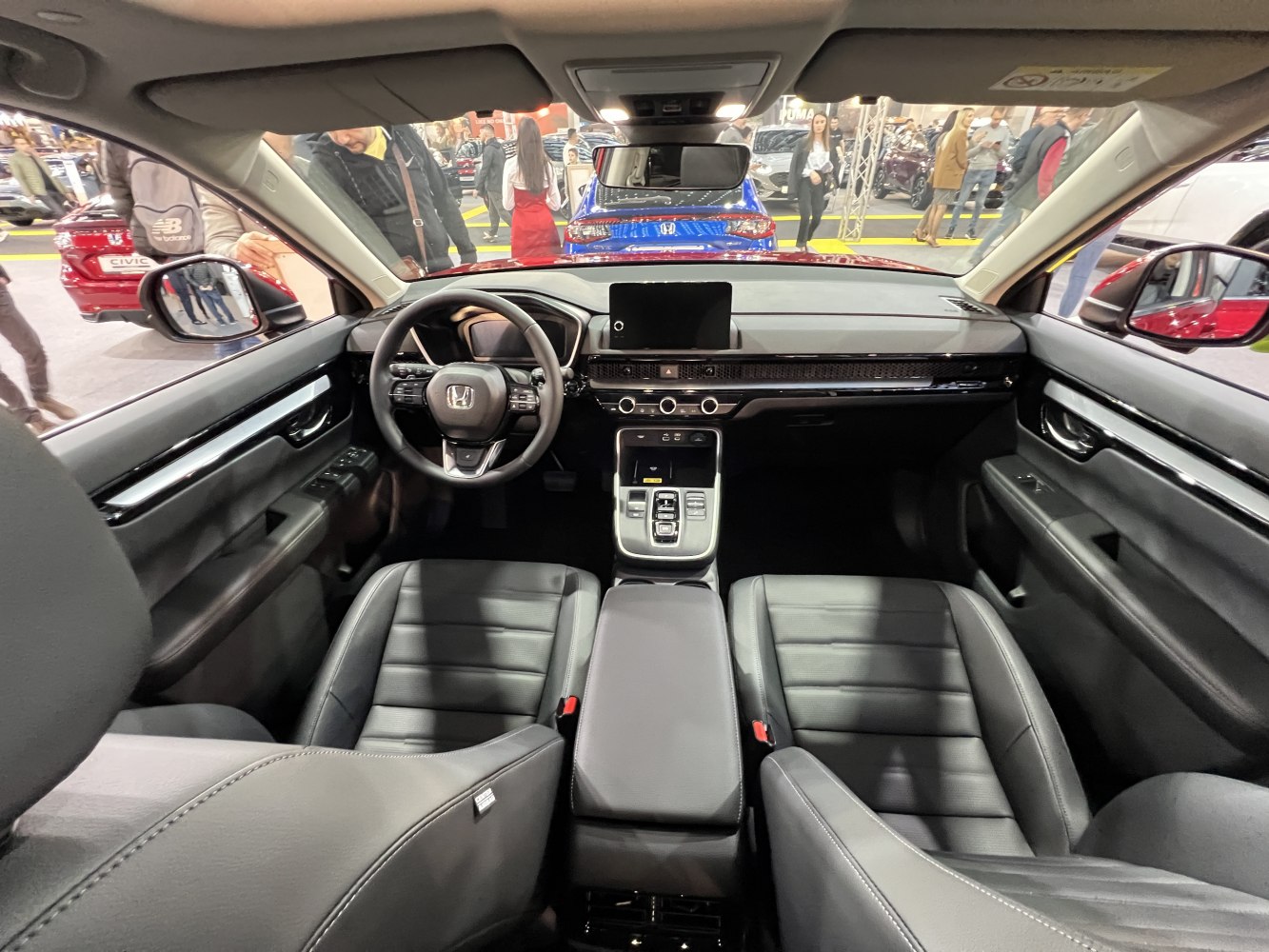 Modern dashboard and steering wheel with touchscreen and leather seats