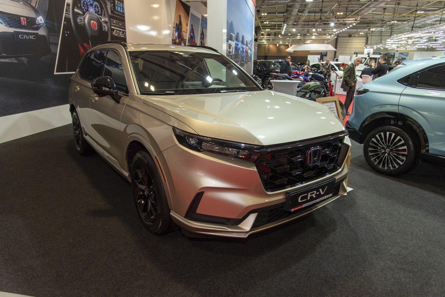 Front view of a modern SUV with sleek headlights and a bold black grill