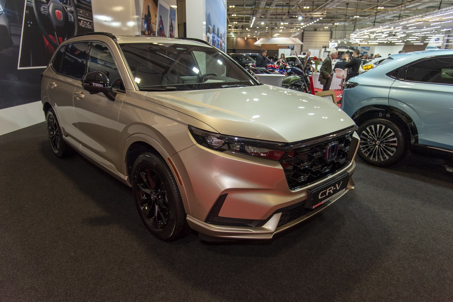 Front view of modern SUV with LED headlights and sporty wheels