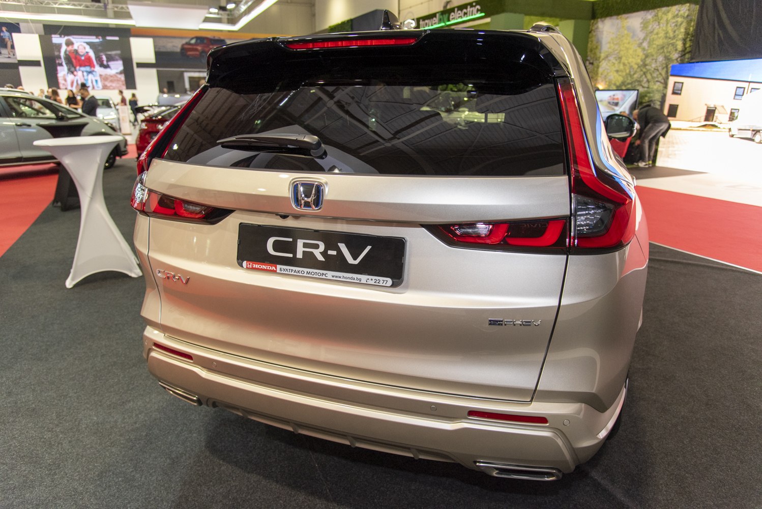 Rear view of SUV with hybrid badge and modern taillights