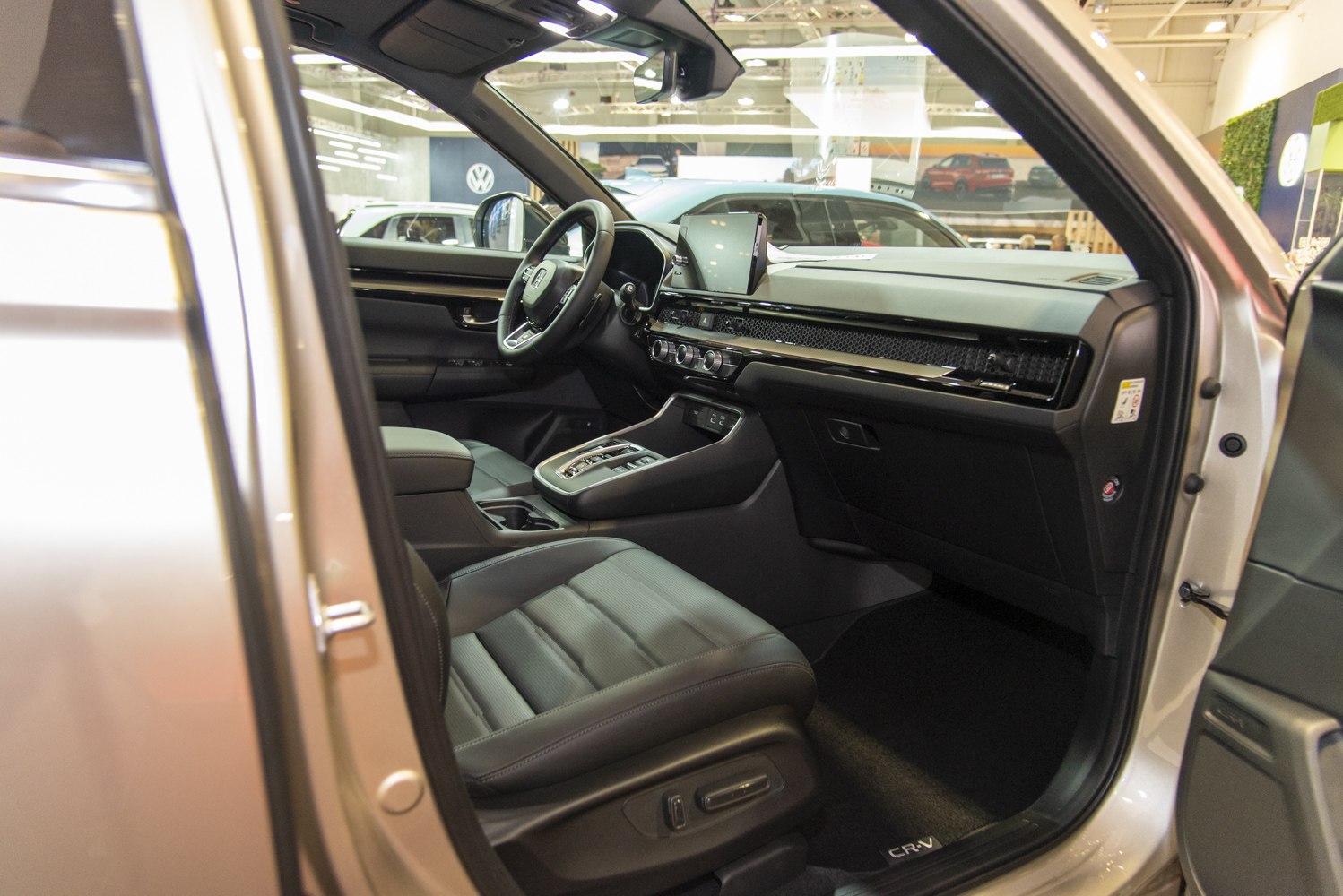 Modern dashboard with digital display and leather driver's seat